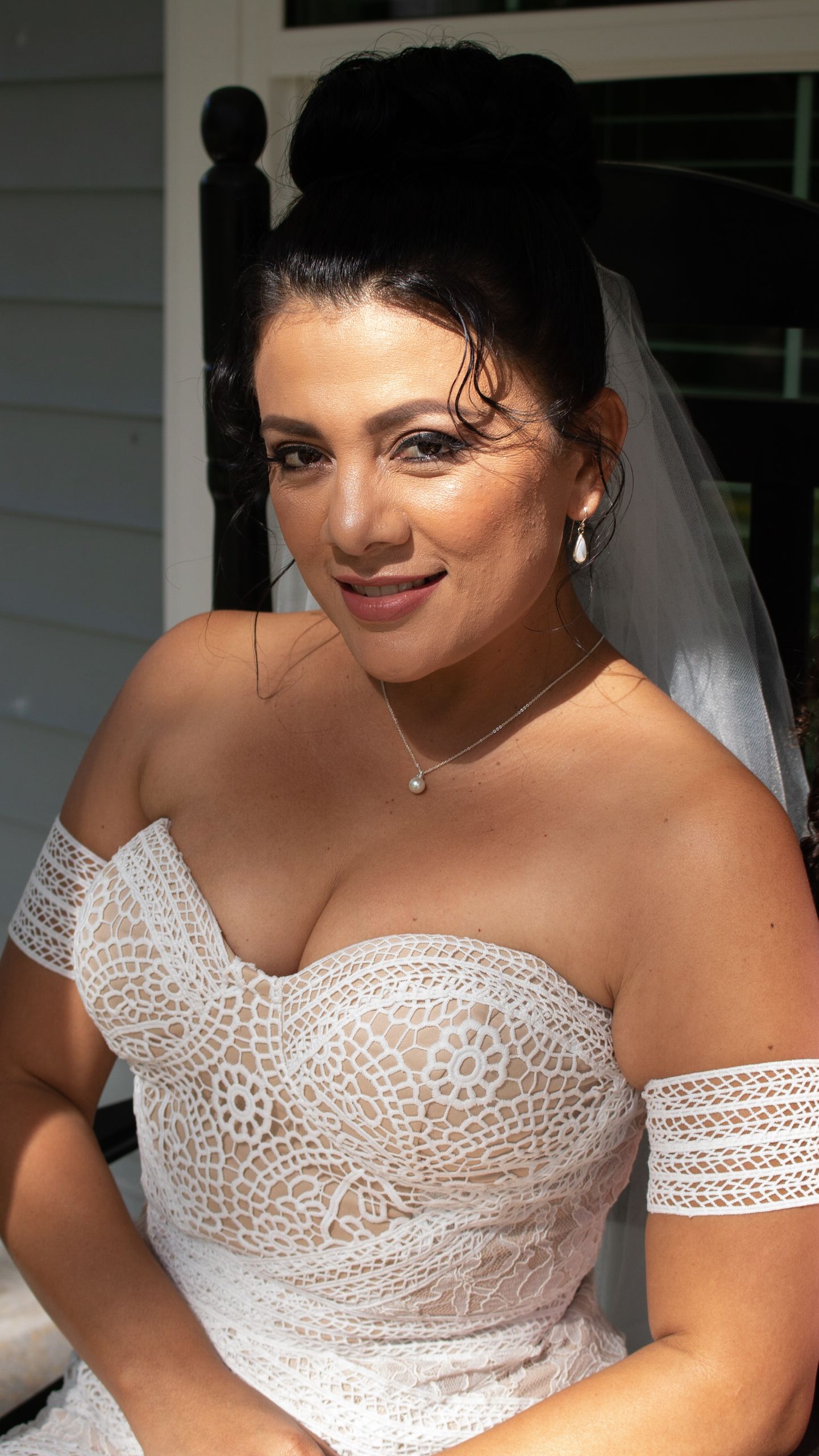 Close-up details of an intricate lace wedding dress bodice.