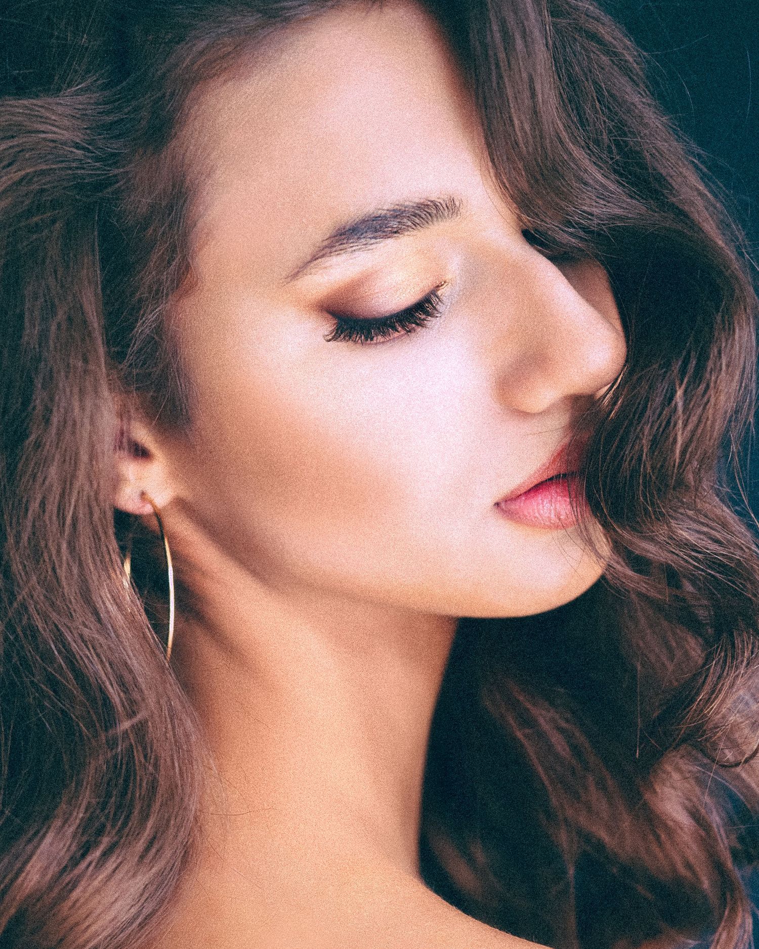 Close-up beauty portrait series with soft pink makeup and flowing brown hair.
