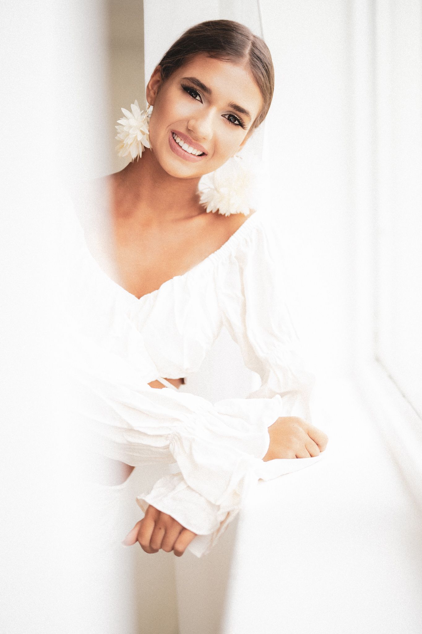 High key portrait series in white clothing with soft ethereal lighting.
