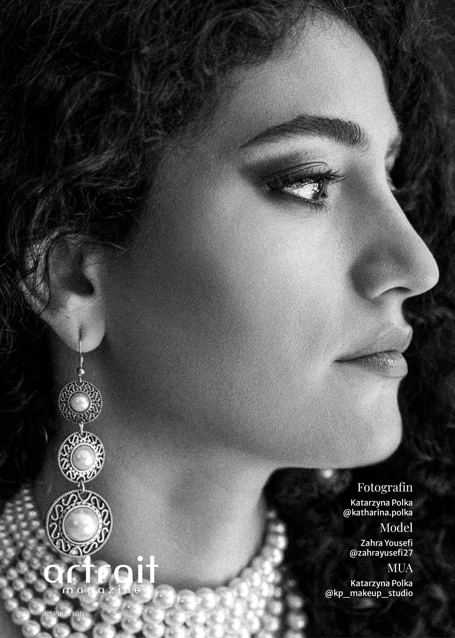 Black and white profile portrait of model Zahra Yousefi wearing pearl necklace and ornate drop earrings.