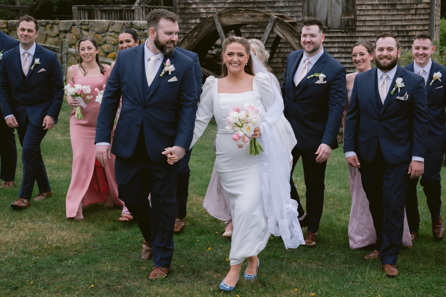 A newlywed couple and their bridal party at Dexter Grist Mill in Sandwich, MA, Cape Cod.