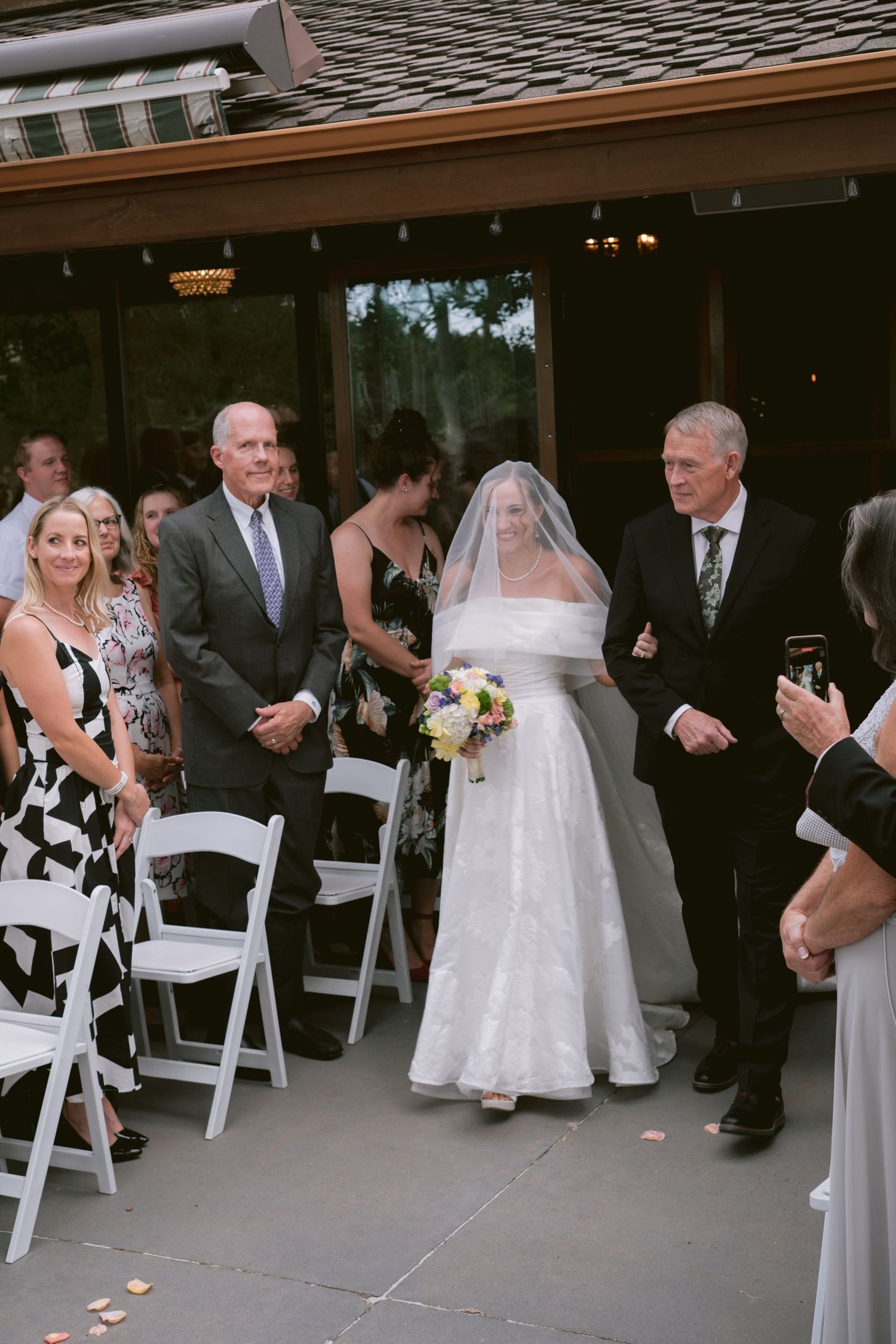 A bride walking down the aisle at Christie's of Genesee in Golden, Colorado.