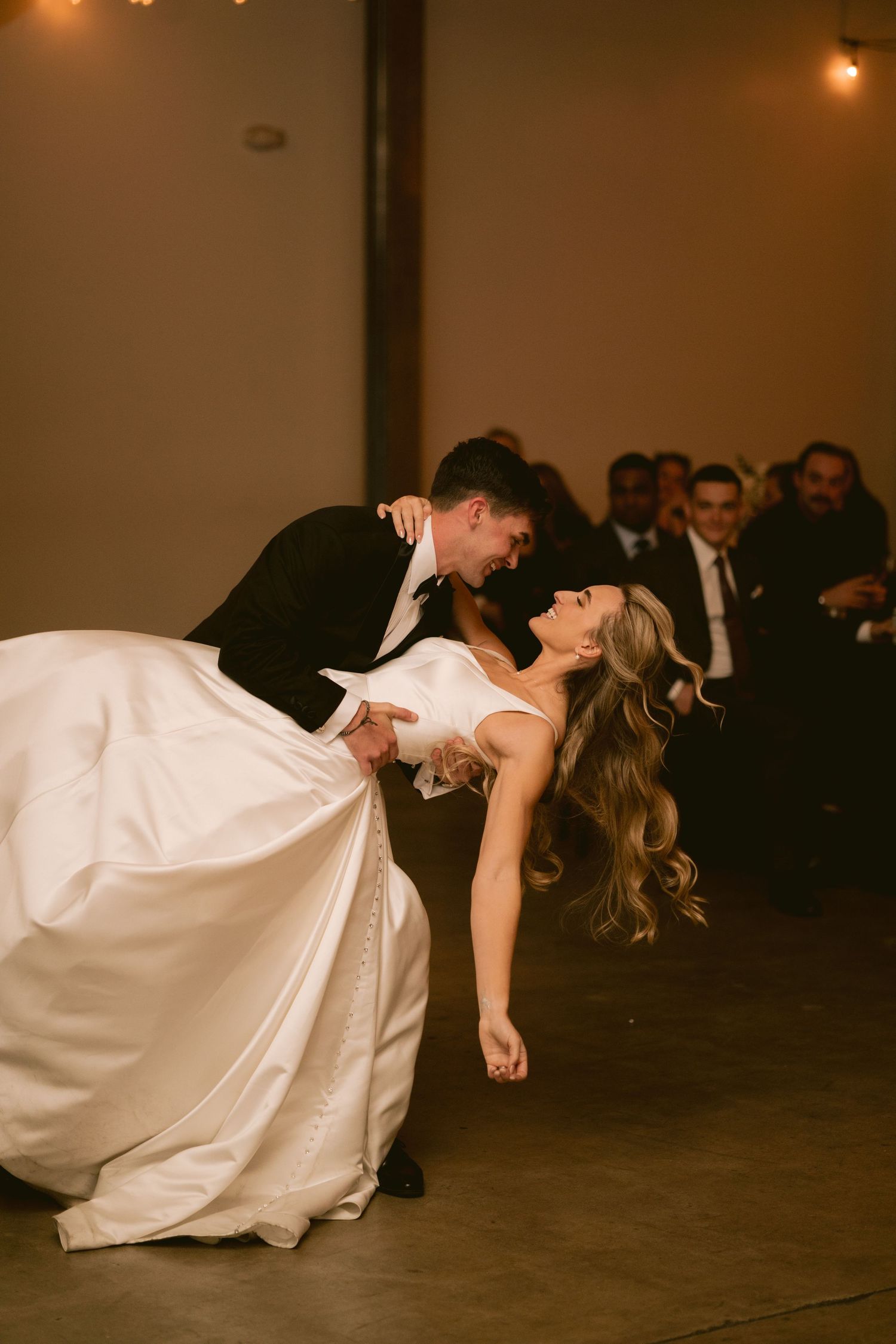 A newlywed couple shares their first dance at Clay Venues in Colorado Springs, CO