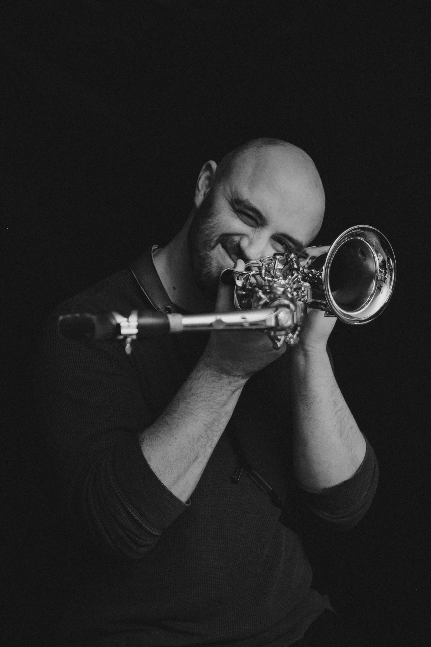 Portrait of a man holding a saxophone