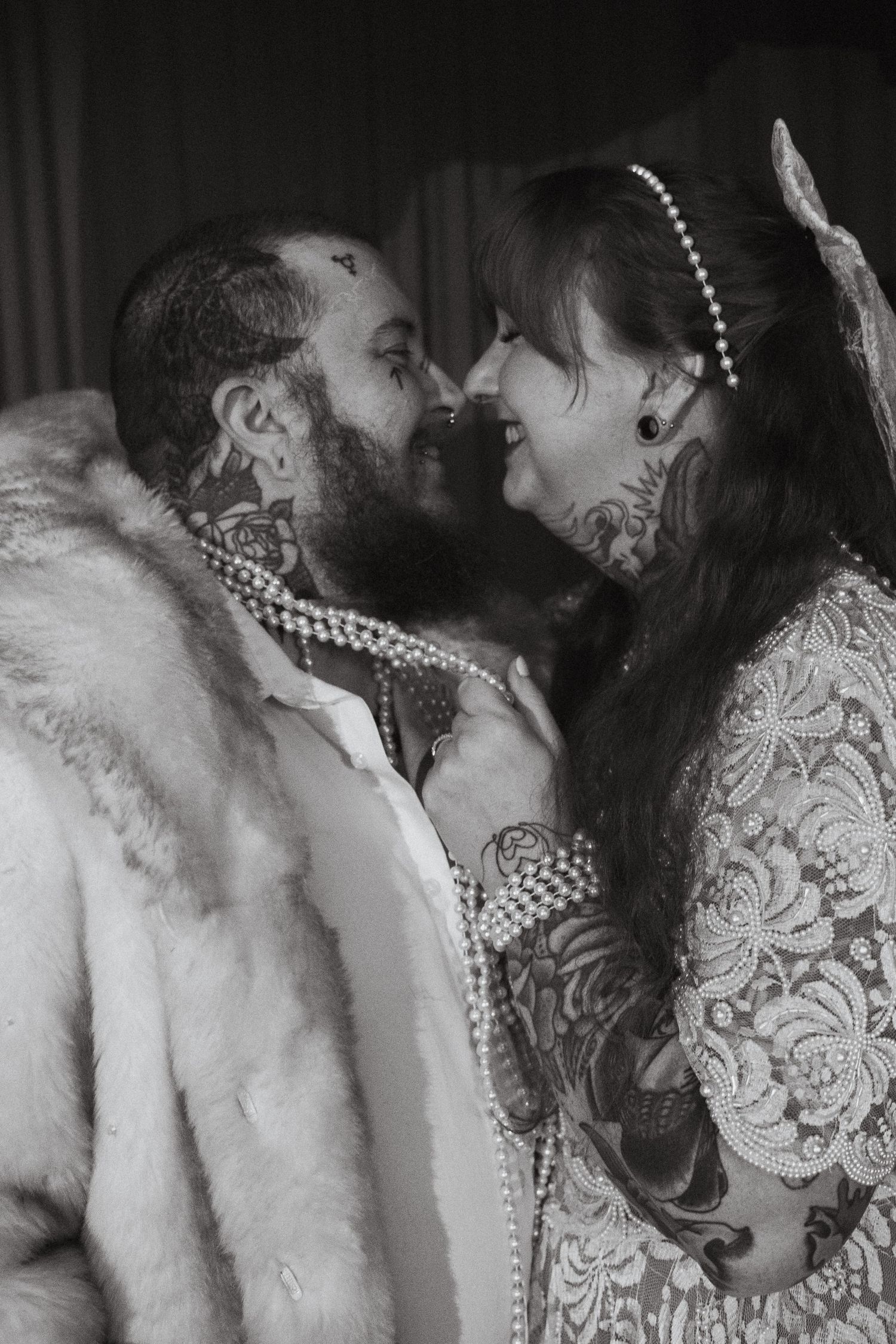An LGBTQ couple laughs with each other