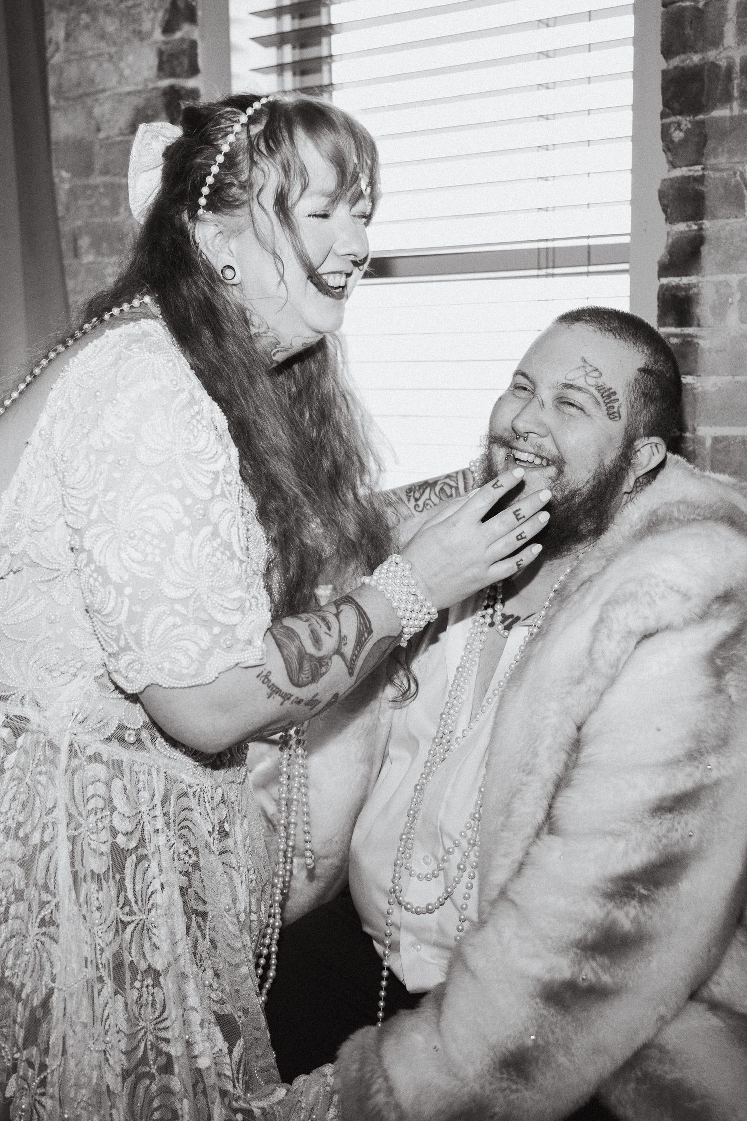 An LGBTQ couple laughing with each other