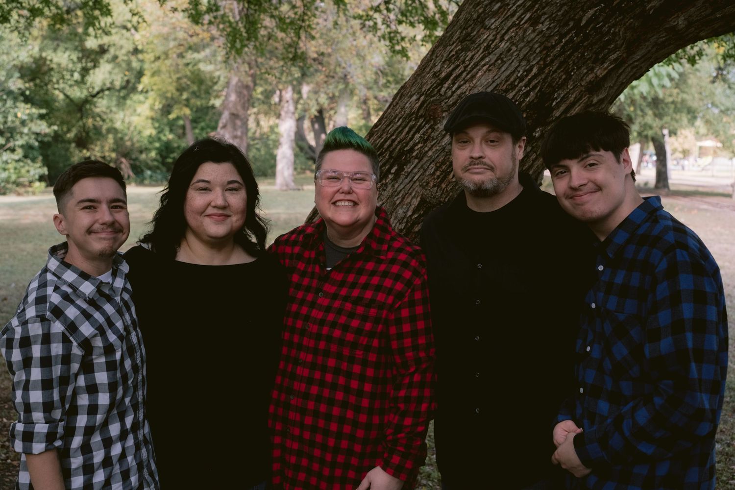A family posing in a park in Fort Worth, TX