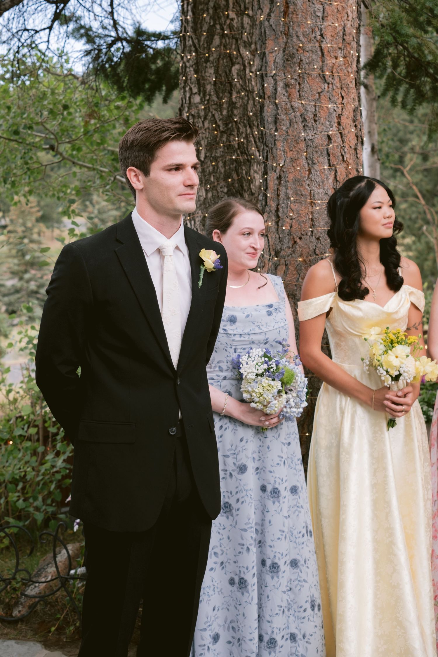 A groom watching his bride walk down the aisle at Christie's of Genesee in Golden, Colorado.