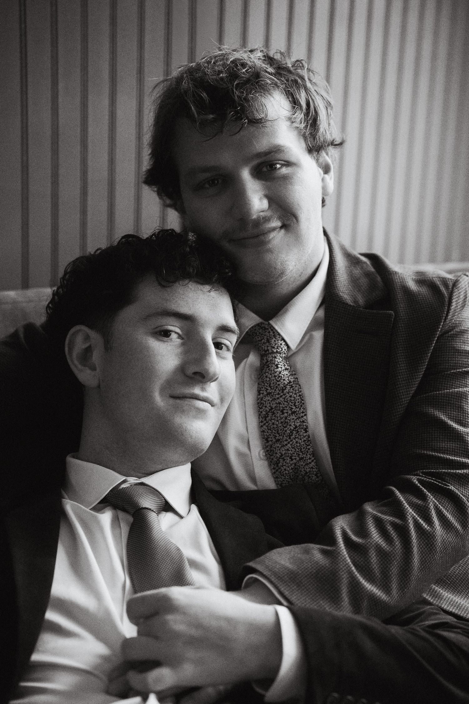 Two grooms embracing