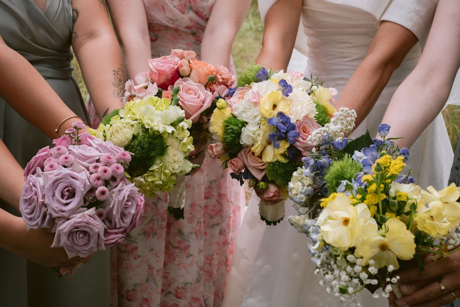 A bridal party shows off their bouquets in Colorado