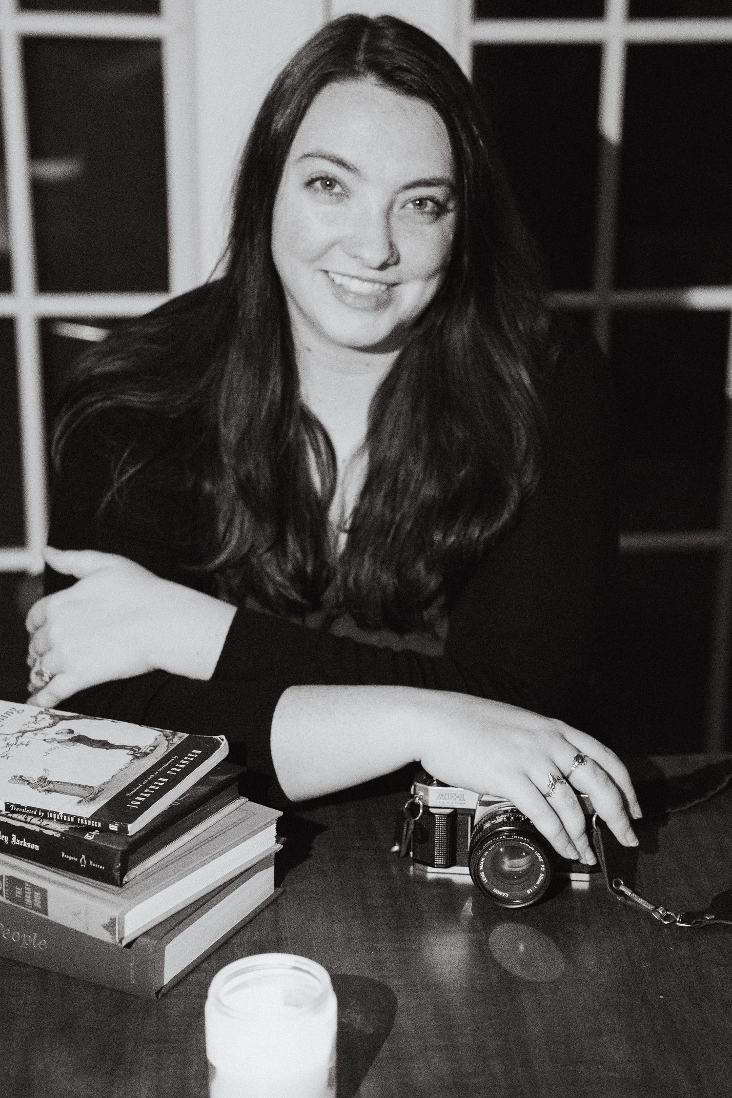 Woman posing with camera in Denton, TX