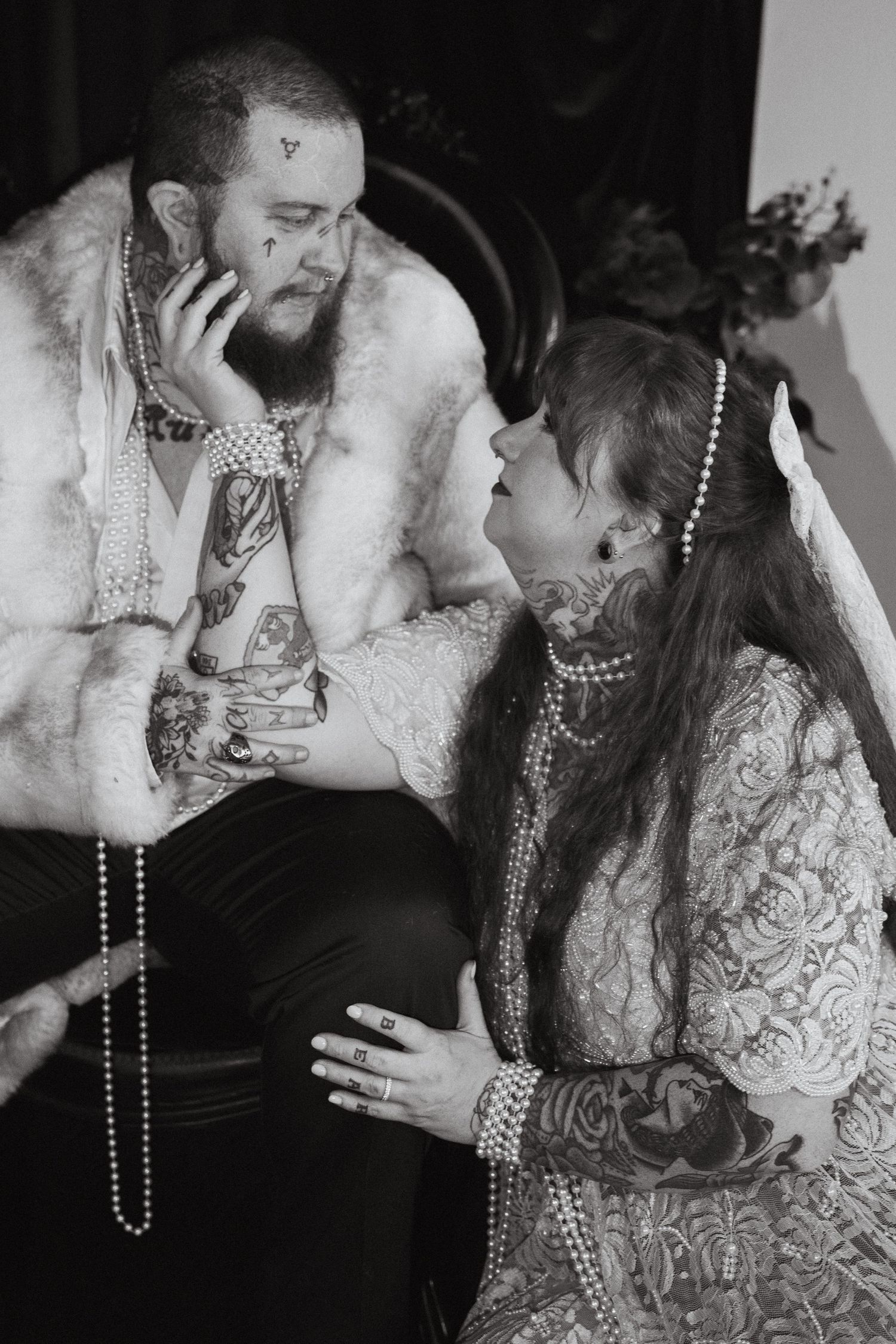 An LGBTQ couple looks longingly at each other