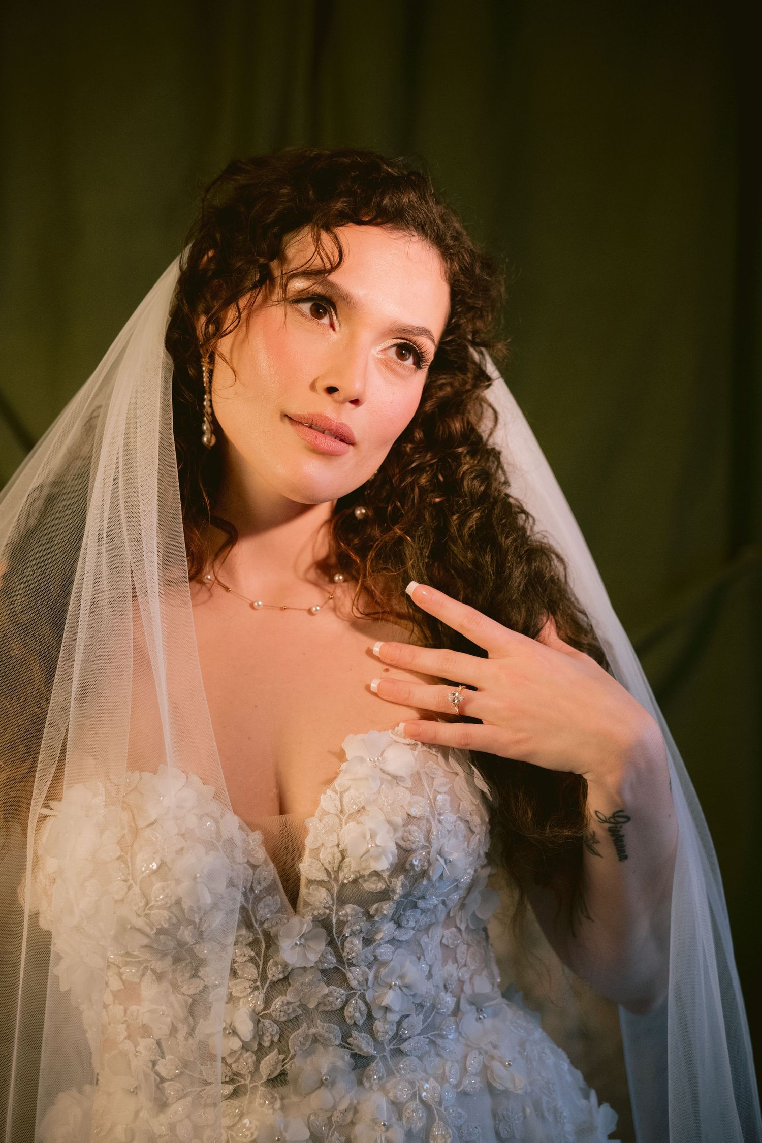 A bride posing in her veil