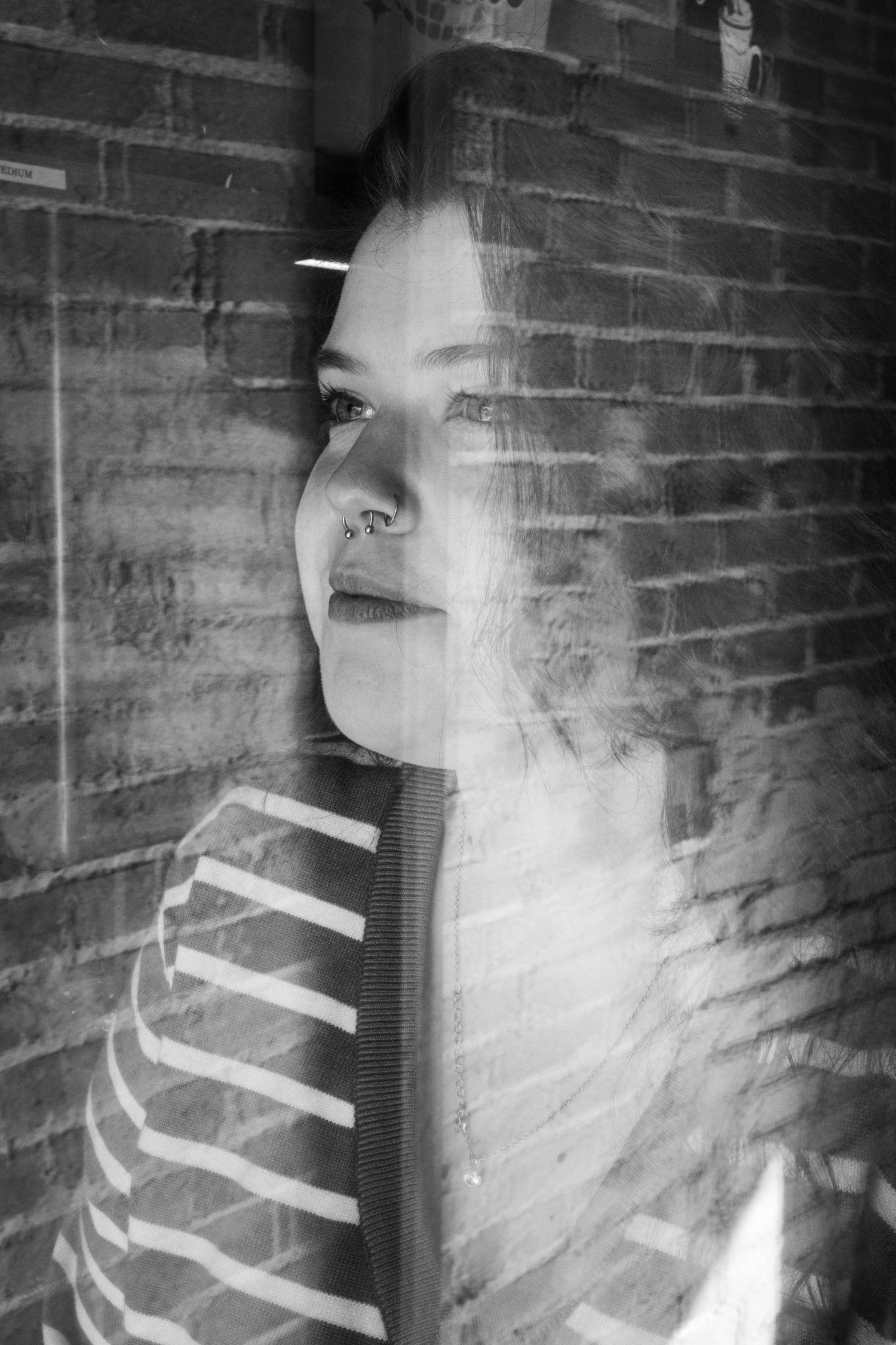 Portrait of a woman through a window in Denton, TX
