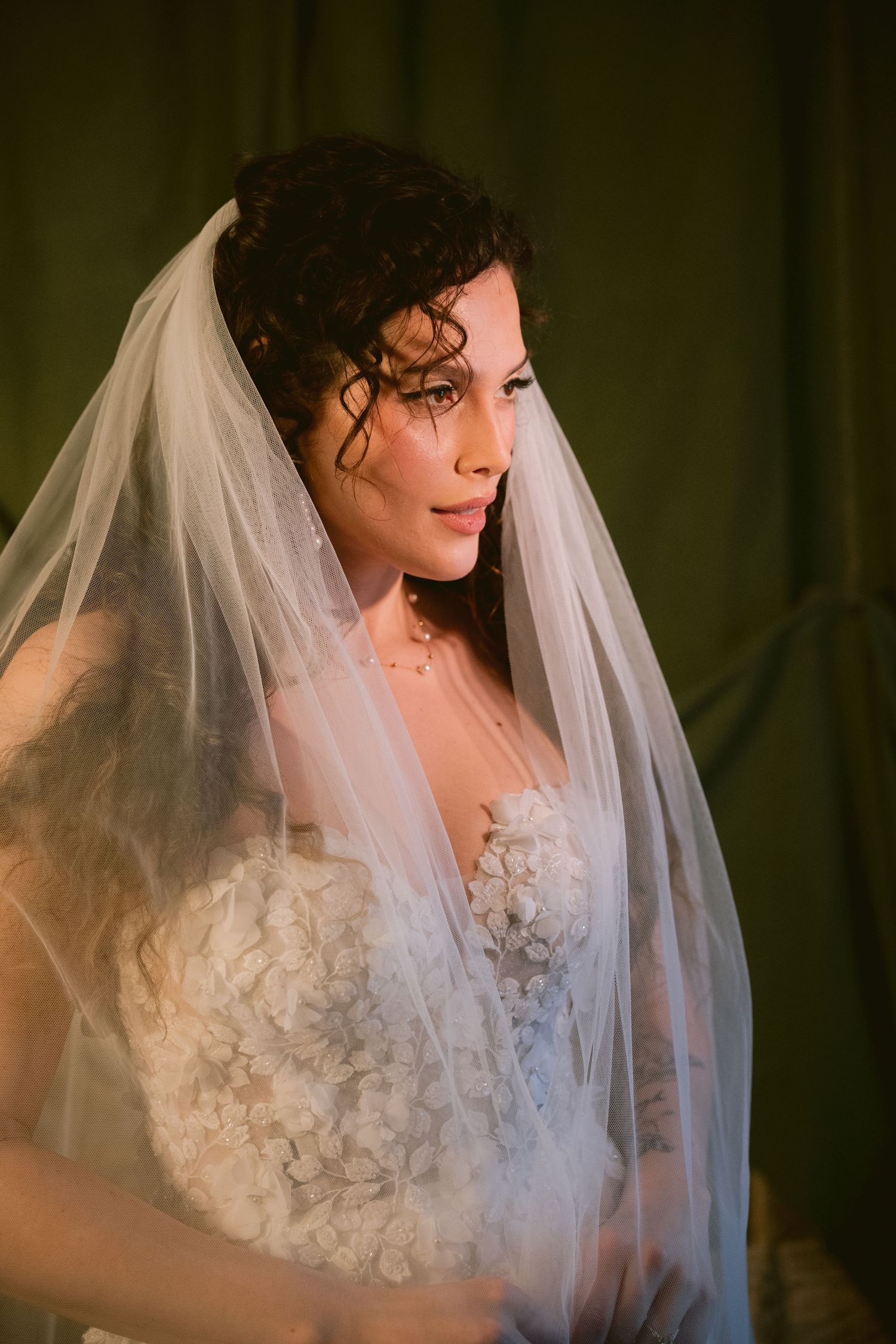 A bride posing in her veil