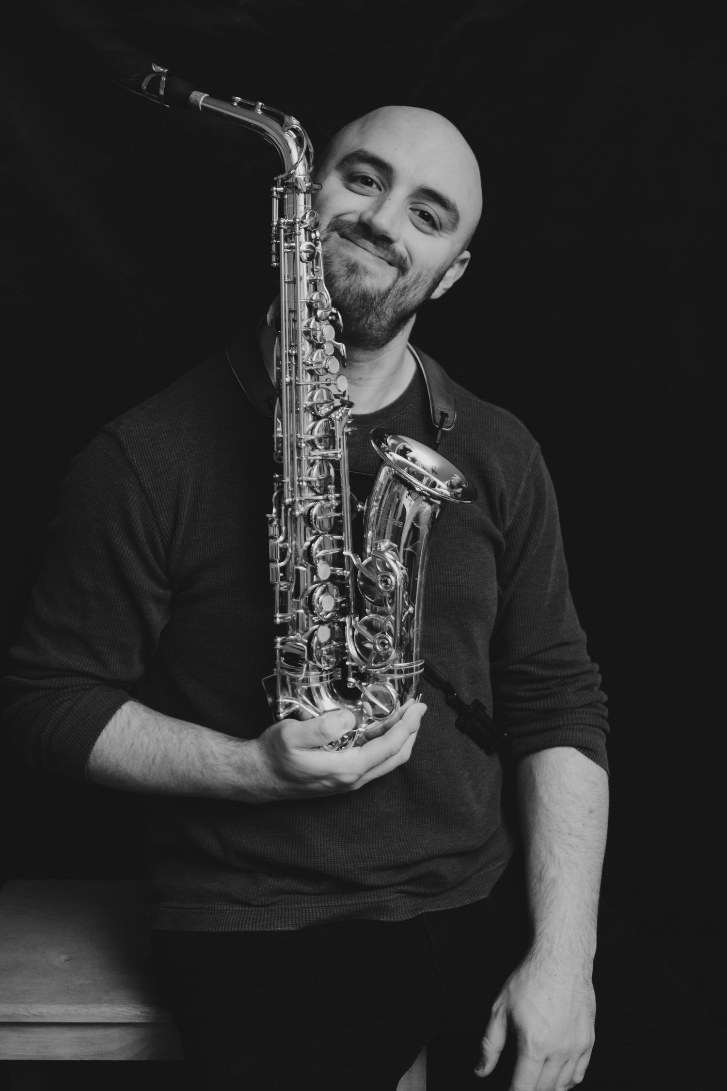 Portrait of a man holding a saxophone