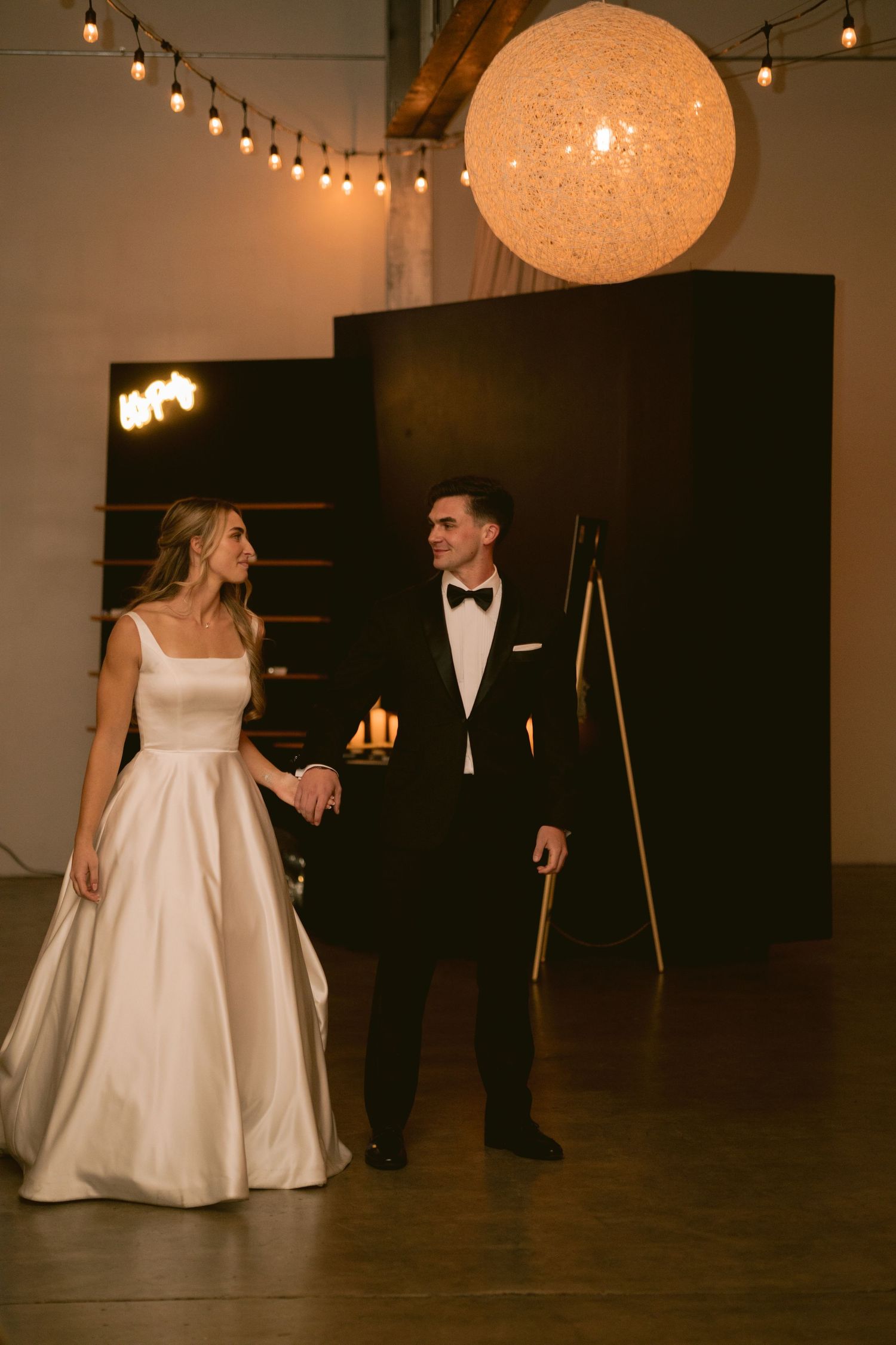 A newlywed couple shares their first dance at Clay Venues in Colorado Springs, CO