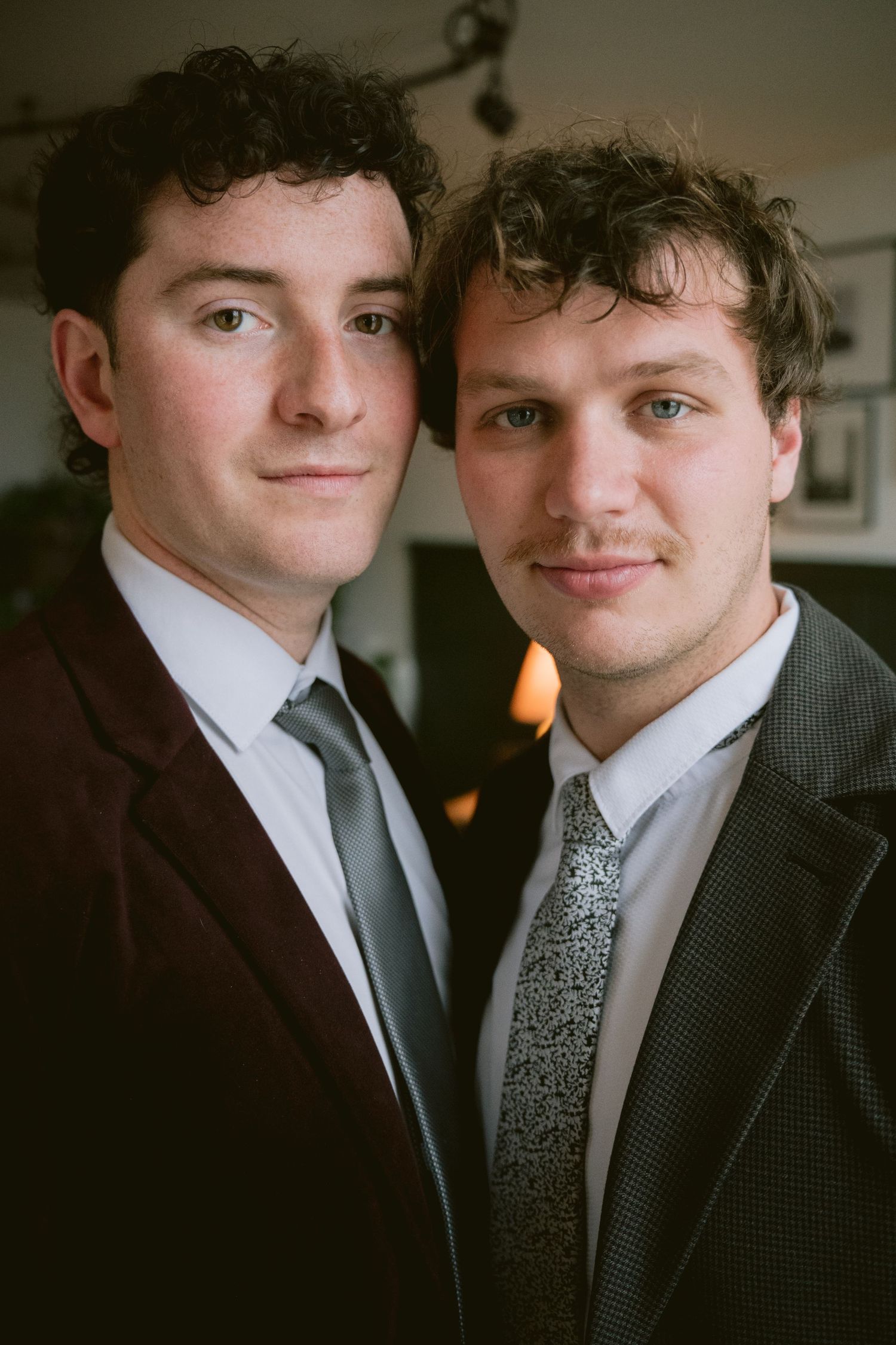 Two grooms looking at the camera