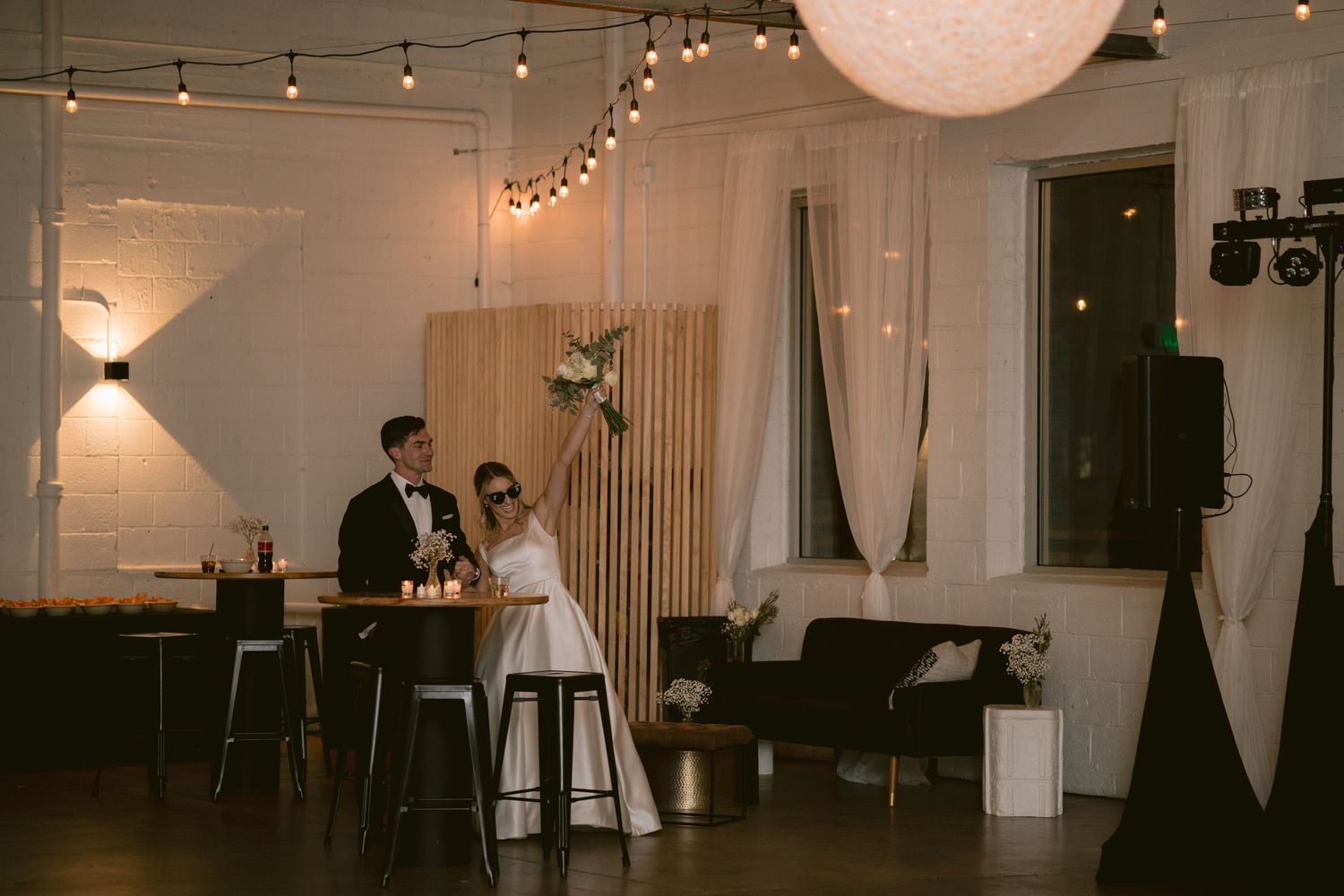A newlywed couple shares their grand entrance at Clay Venues in Colorado Springs, CO