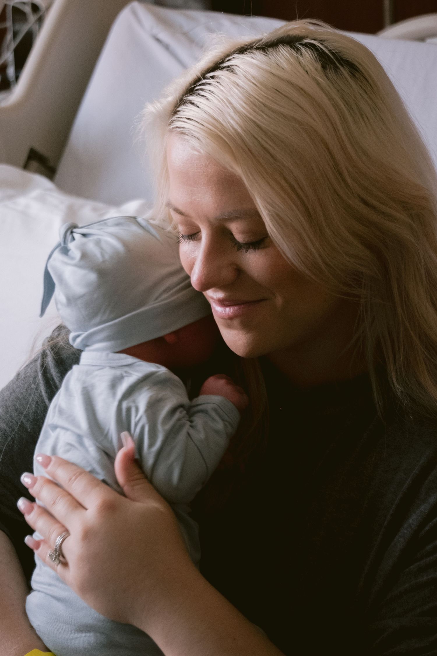 A mom holding her newborn in Fort Worth, TX