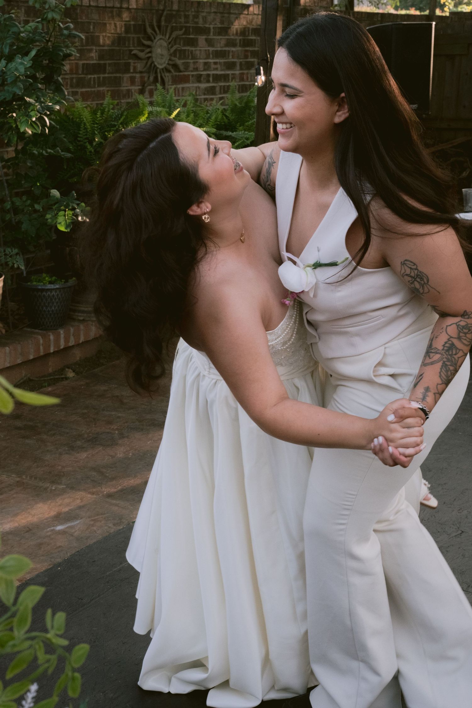 Two brides at their backyard wedding in Denton, TX
