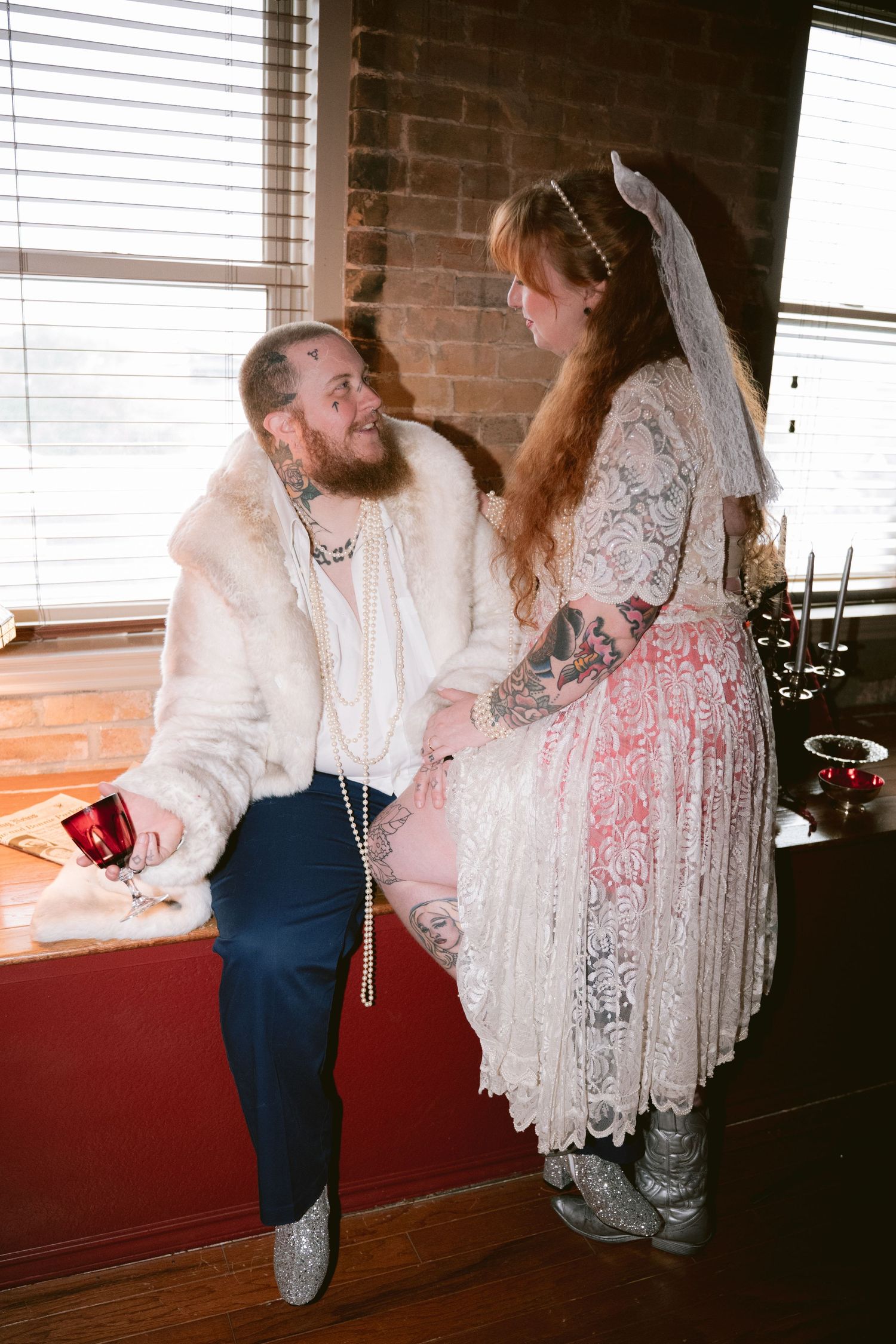 An LGBTQ couple looks longingly at each other