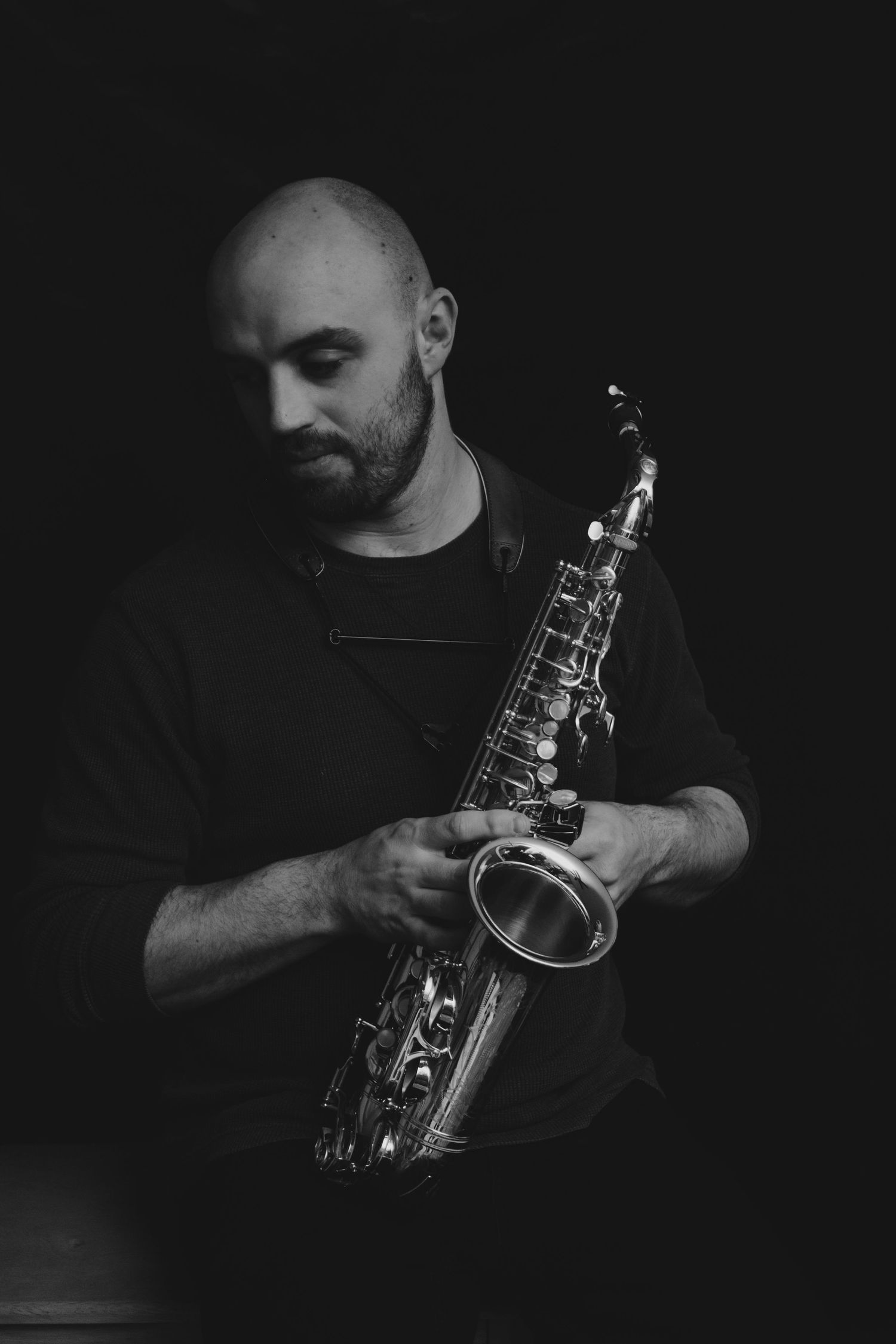 Portrait of a man holding a saxophone