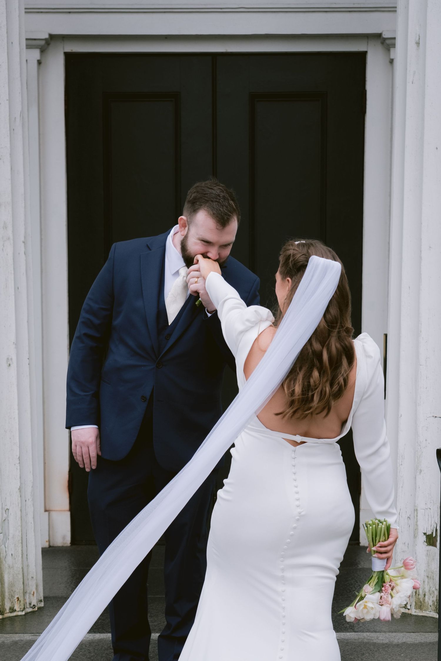 A newlywed couple at Sandwich City Hall in Sandwich, MA, Cape Cod.