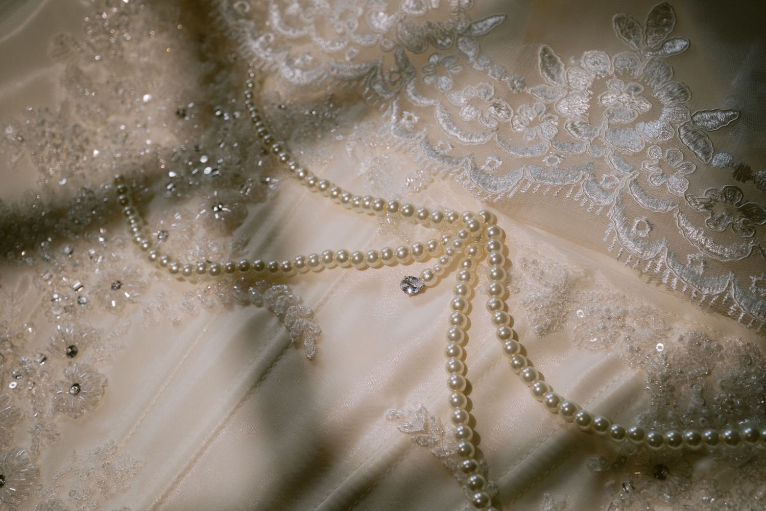 Detail photo of a bride's dress and veil.