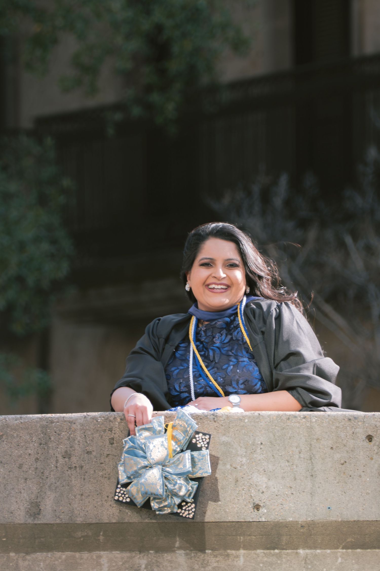 A graduate at the Mandalay Canal Walk in Las Colinas, TX