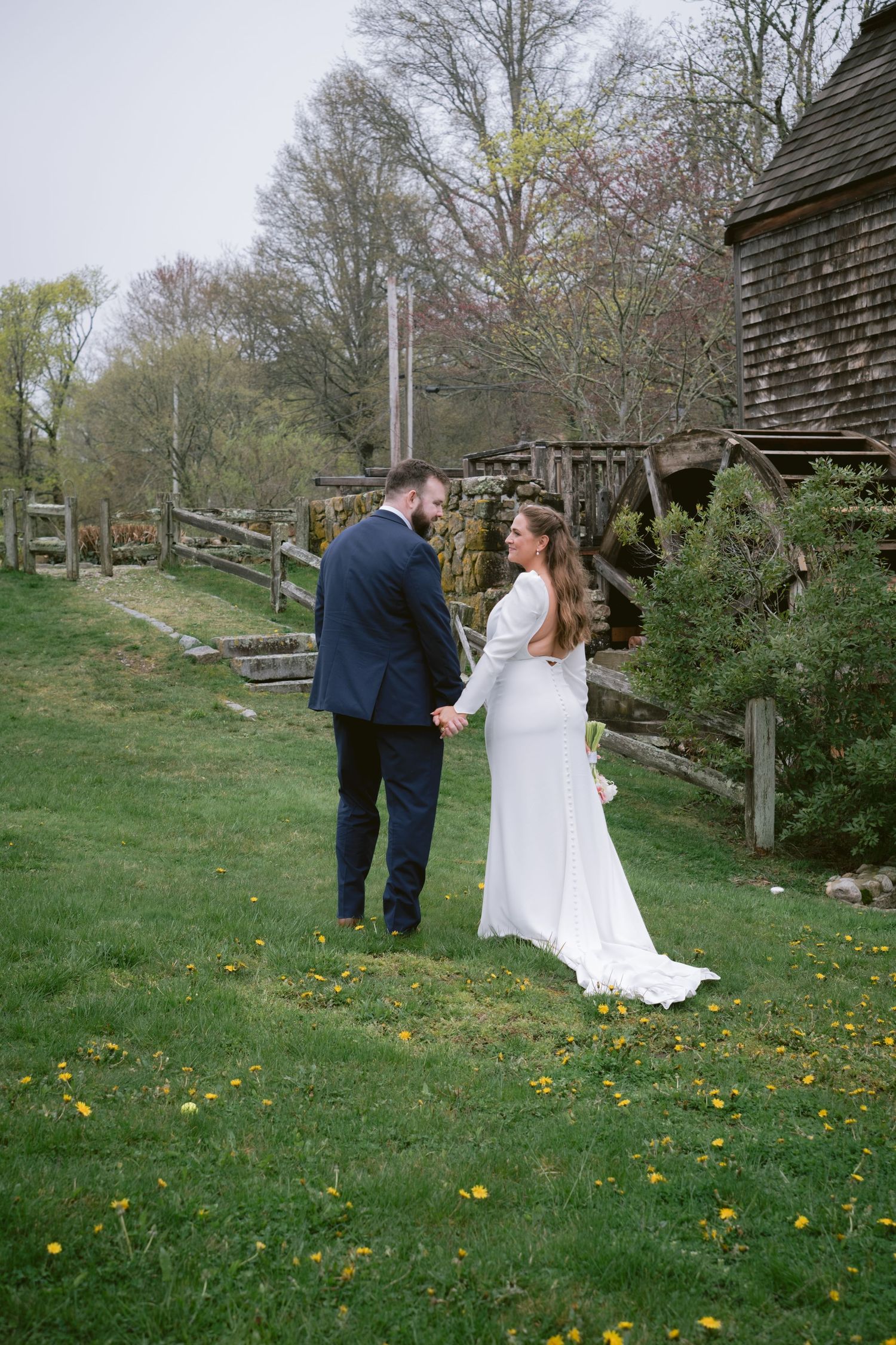 A newlywed couple at Dexter Grist Mill in Sandwich, MA, Cape Cod.