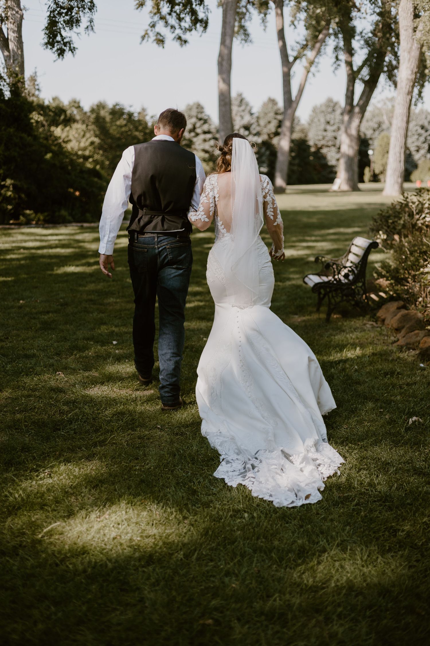 Couple candid photo after saying I do in Liliac Hill Events center in Louisville Nebraska