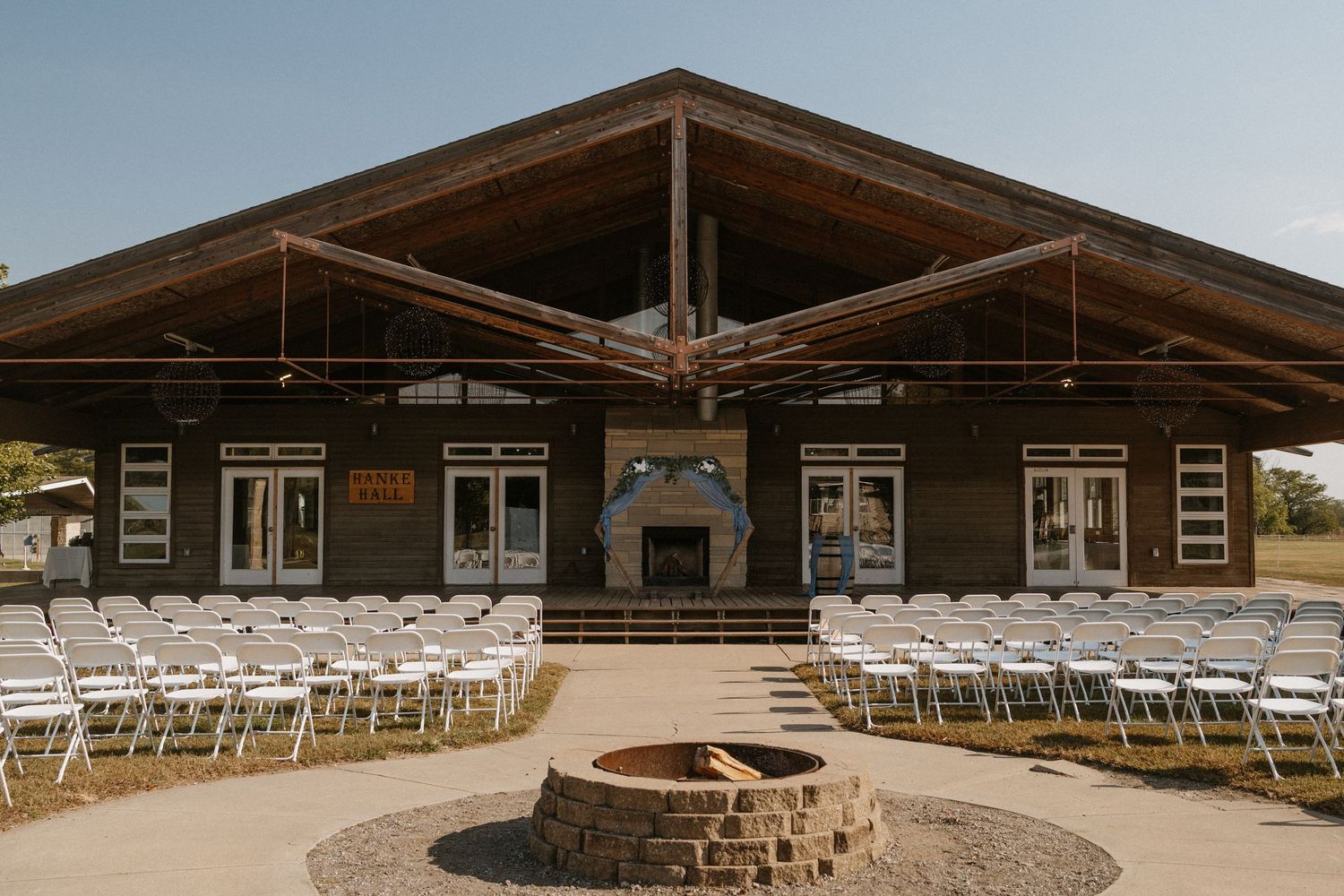 Outdoor wedding reception at Falconwood Park in Bellevue, NE with relaxed and joyful atmosphere.