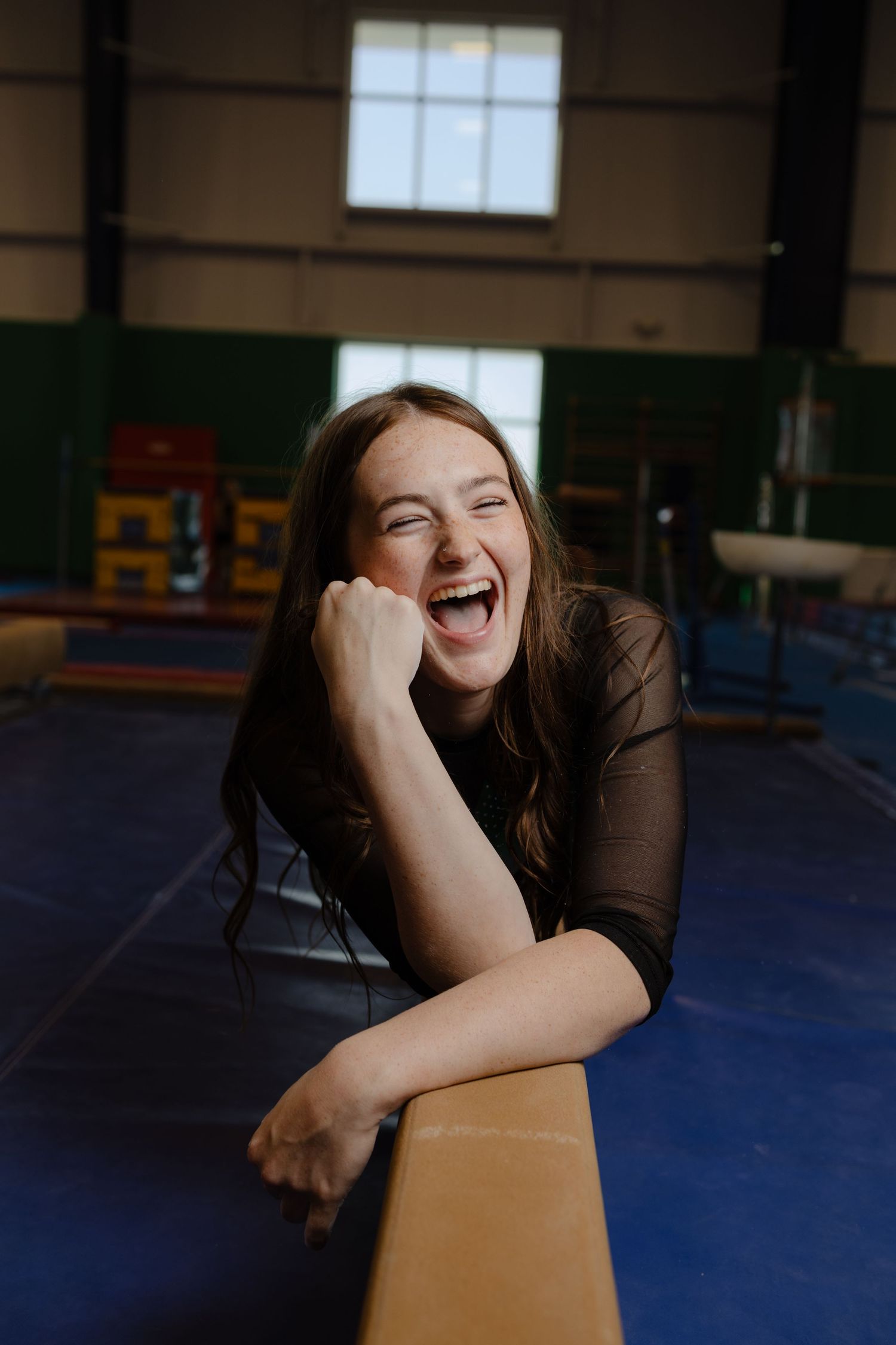 Papillion Nebraska high school senior, gymnastics portrait in Metro Stars Gym in Papillion Nebraska.