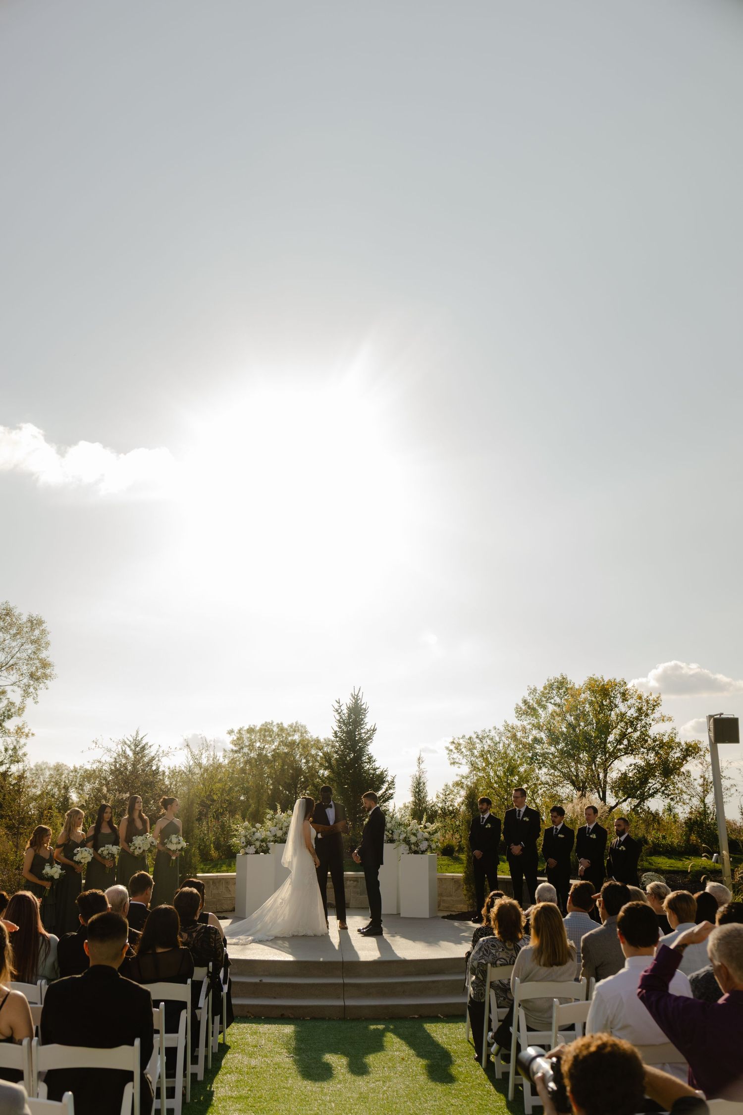 Ceremony photography at The Acreage in Palmyra Nebraska for a fall wedding.