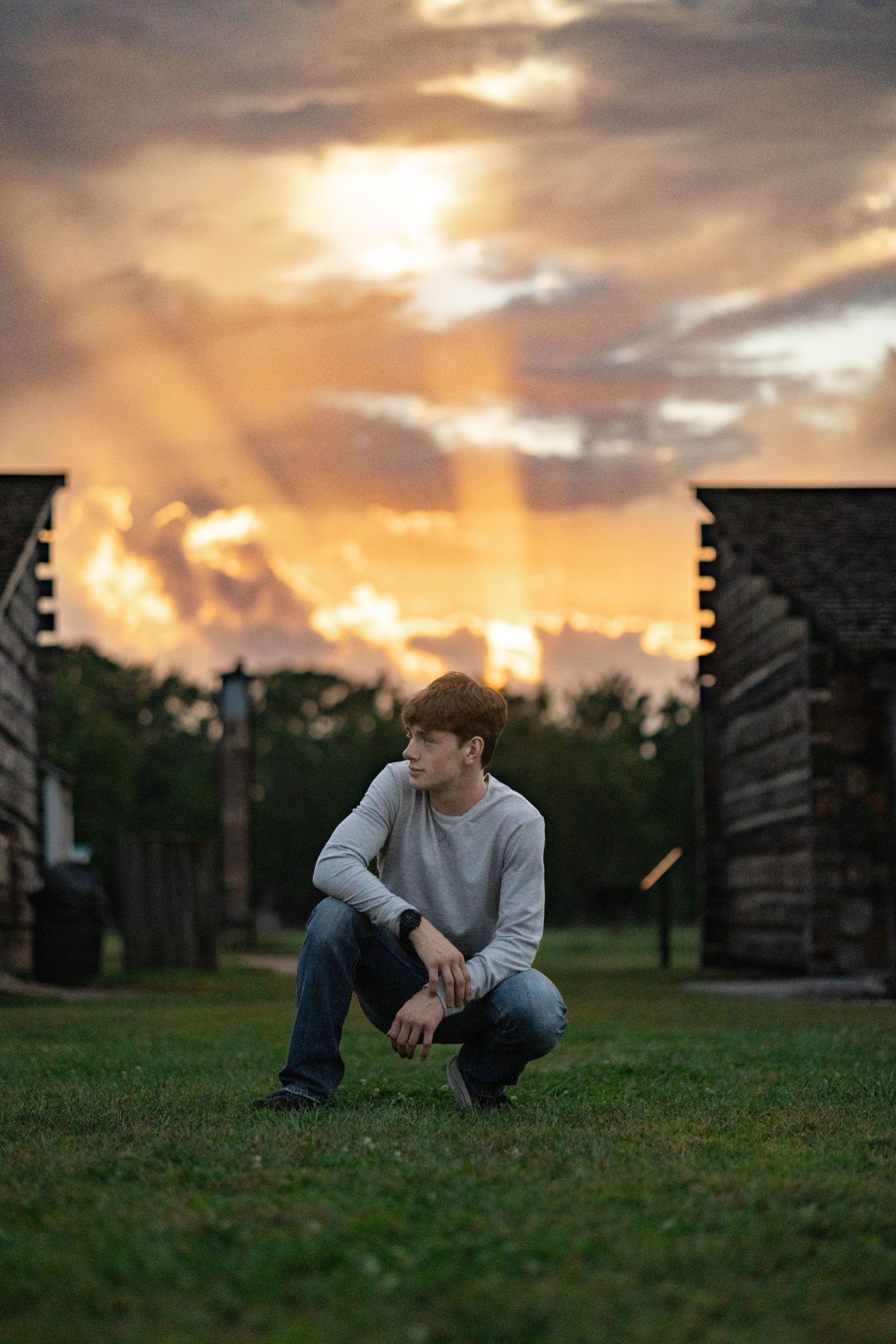 Nebraska senior portraits at sunset in open field in Fort Calhoun Nebraska