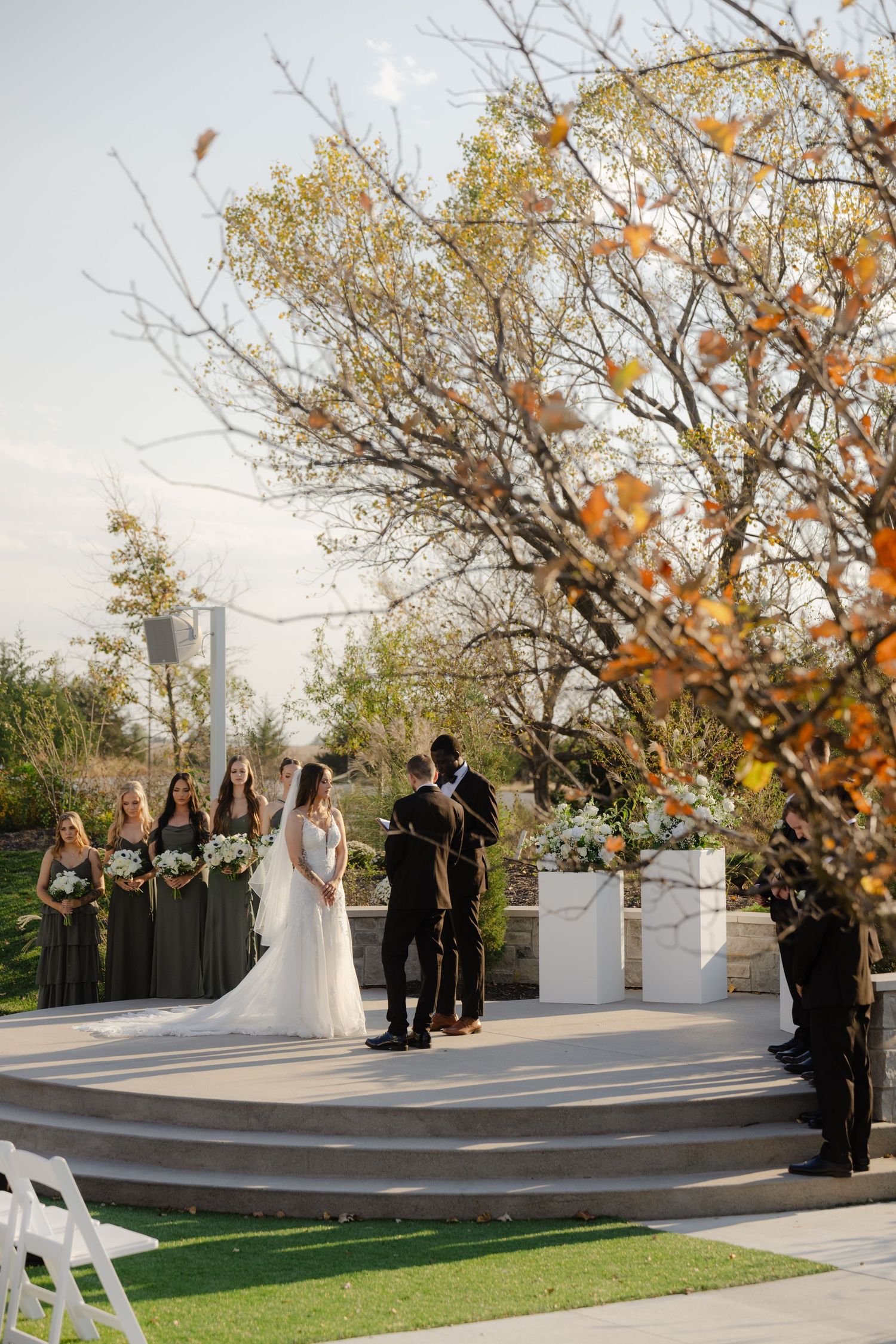 Ceremony photography at The Acreage in Palmyra Nebraska for a fall wedding.