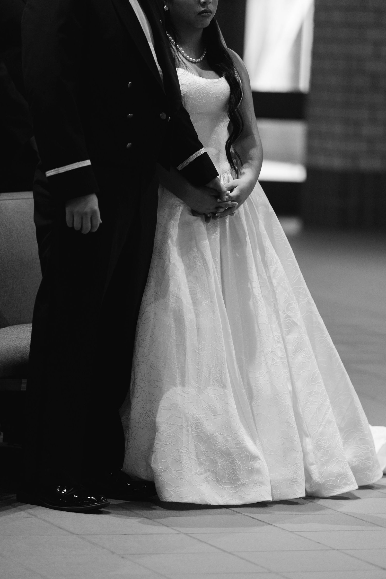 Ceremony couple detail shot in black and white at Saint Stevens Catholic Church in Omaha Nebraska.