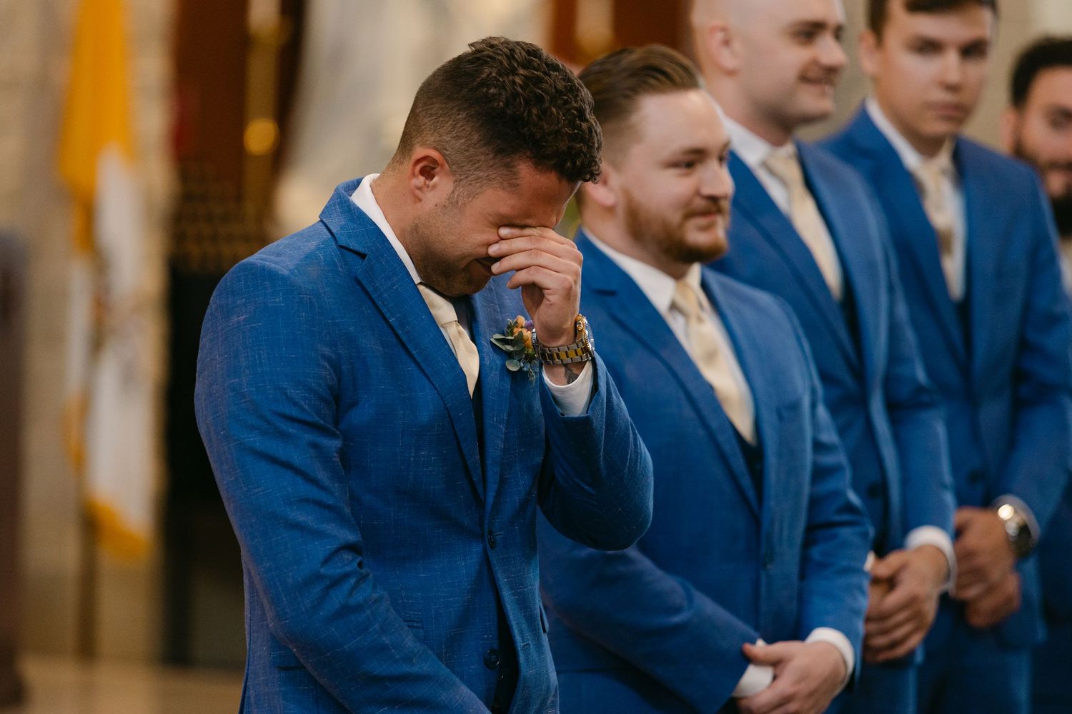 Groom crying at Lincoln Nebraska Catholic wedding