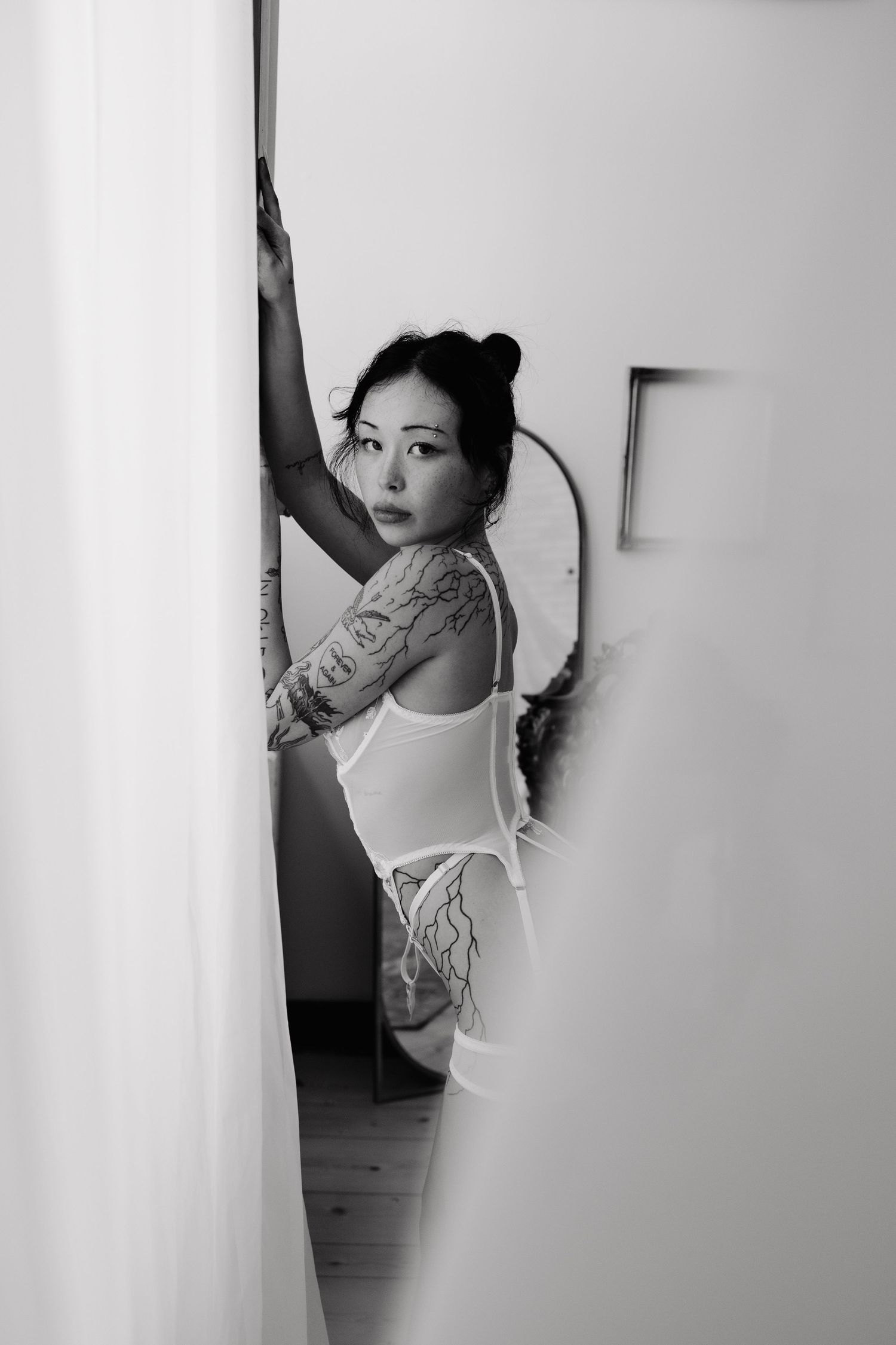 Bridal Boudoir with woman posing in studio in an intimate setting in Plattsmouth Nebraska