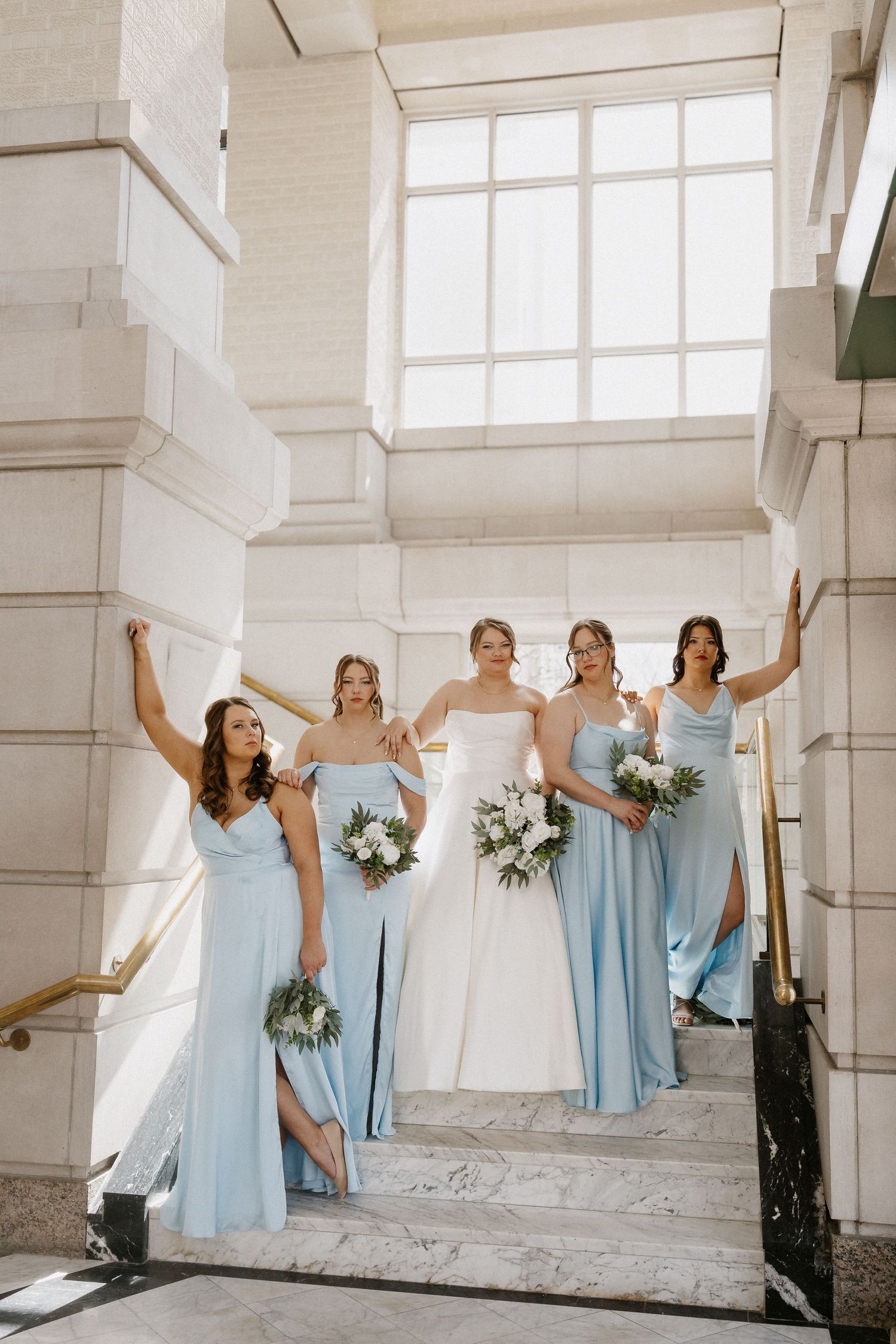 Bride and Bridesmaids at the steps inside Leo ballroom in Omaha Nebraska wedding venue
