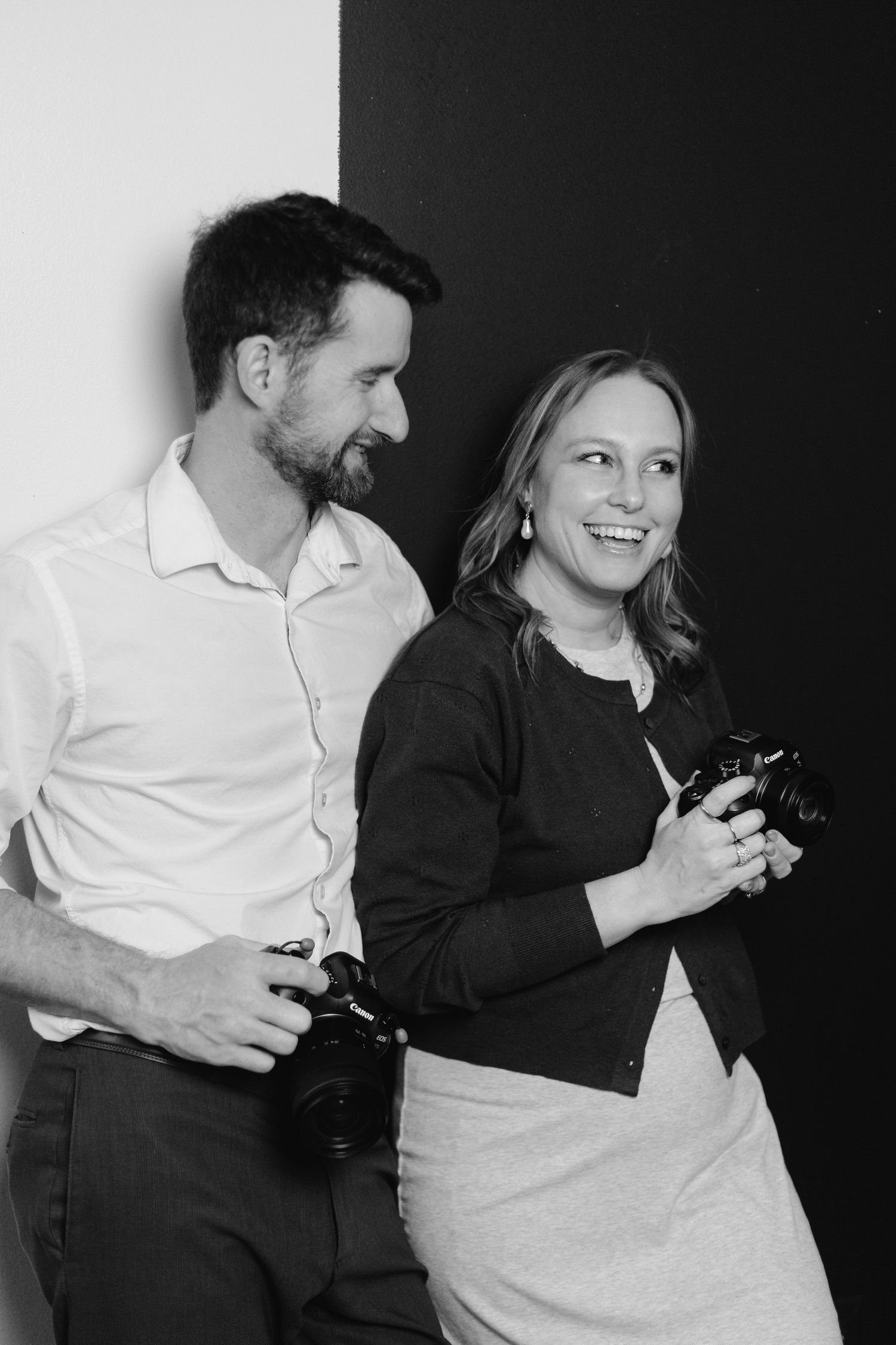 Wedding Photographers posing in studio. Kinsey Nixon-Bay and Matthew Bay