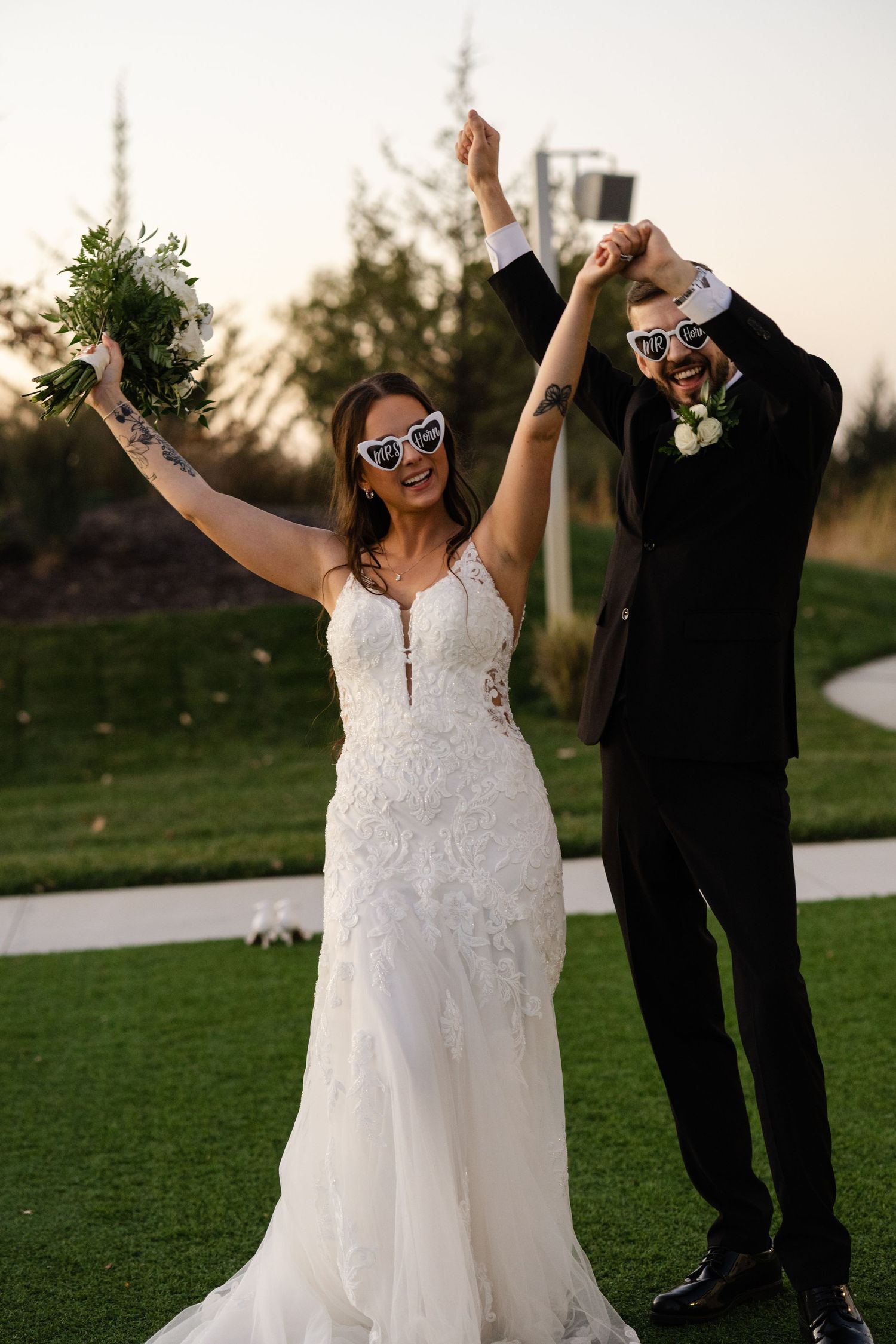 Fun Portraits of the wedding couple at The Acreage in Palmyra Nebraska for a fall wedding.