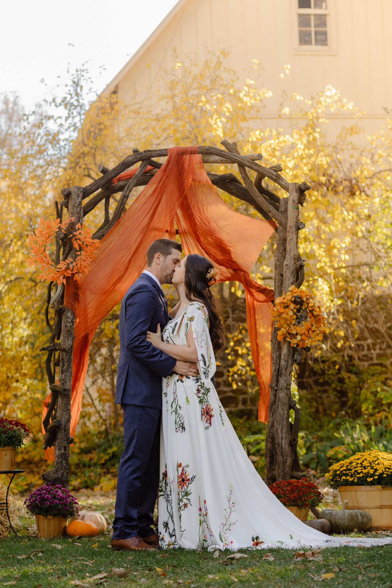 bride and groom under ceremony arch Lilac Hill Nebraska wedding photography Omaha Nebraska