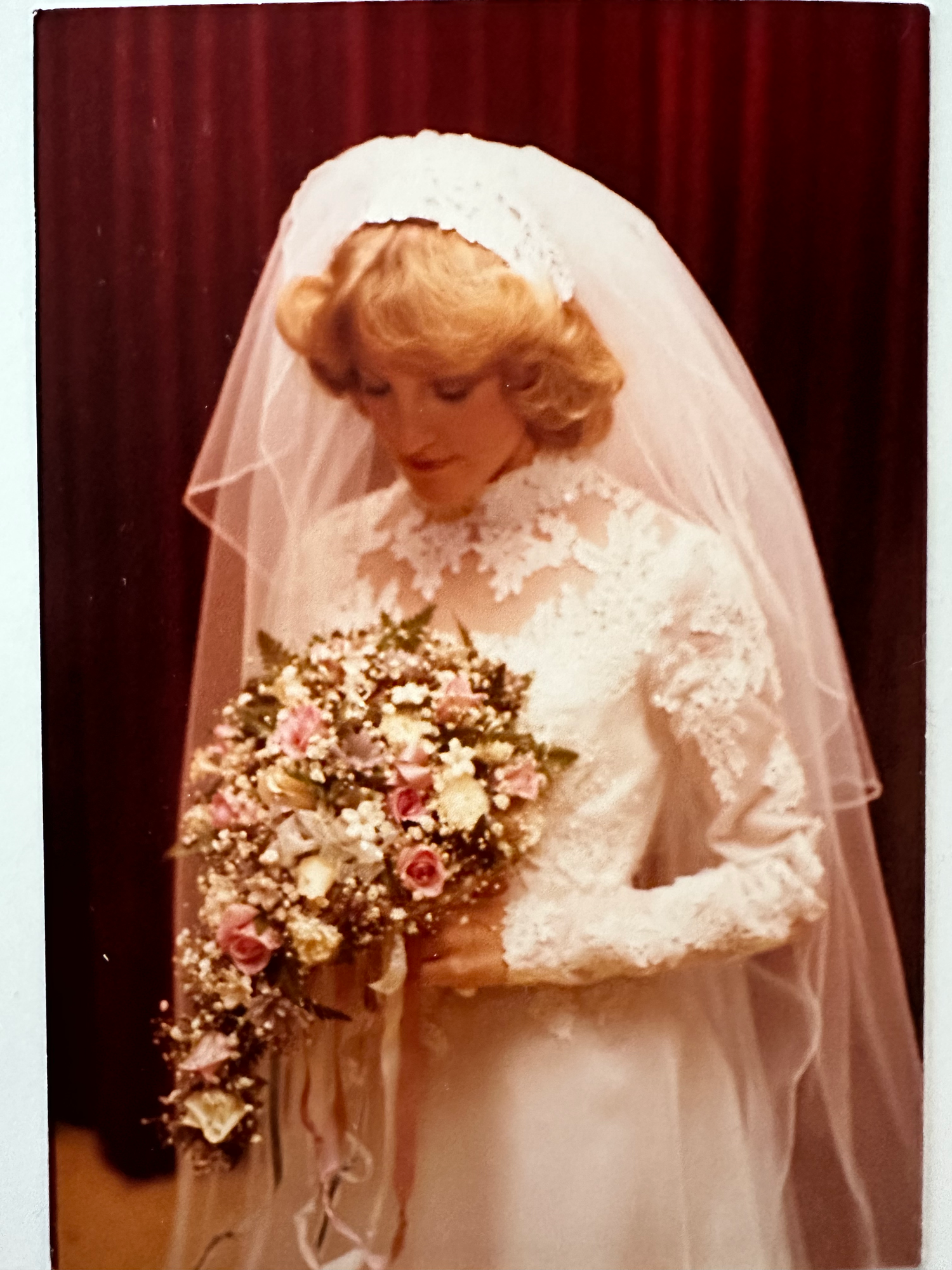 Four vintage bridal portraits showing a bride in white dress holding floral bouquets with delicate veil details.