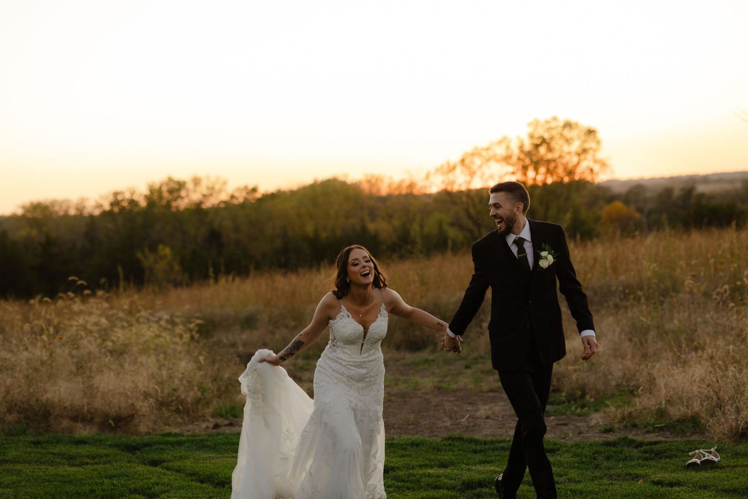 Golden hour portraits of the wedding couple at The Acreage in Palmyra Nebraska for a fall wedding.
