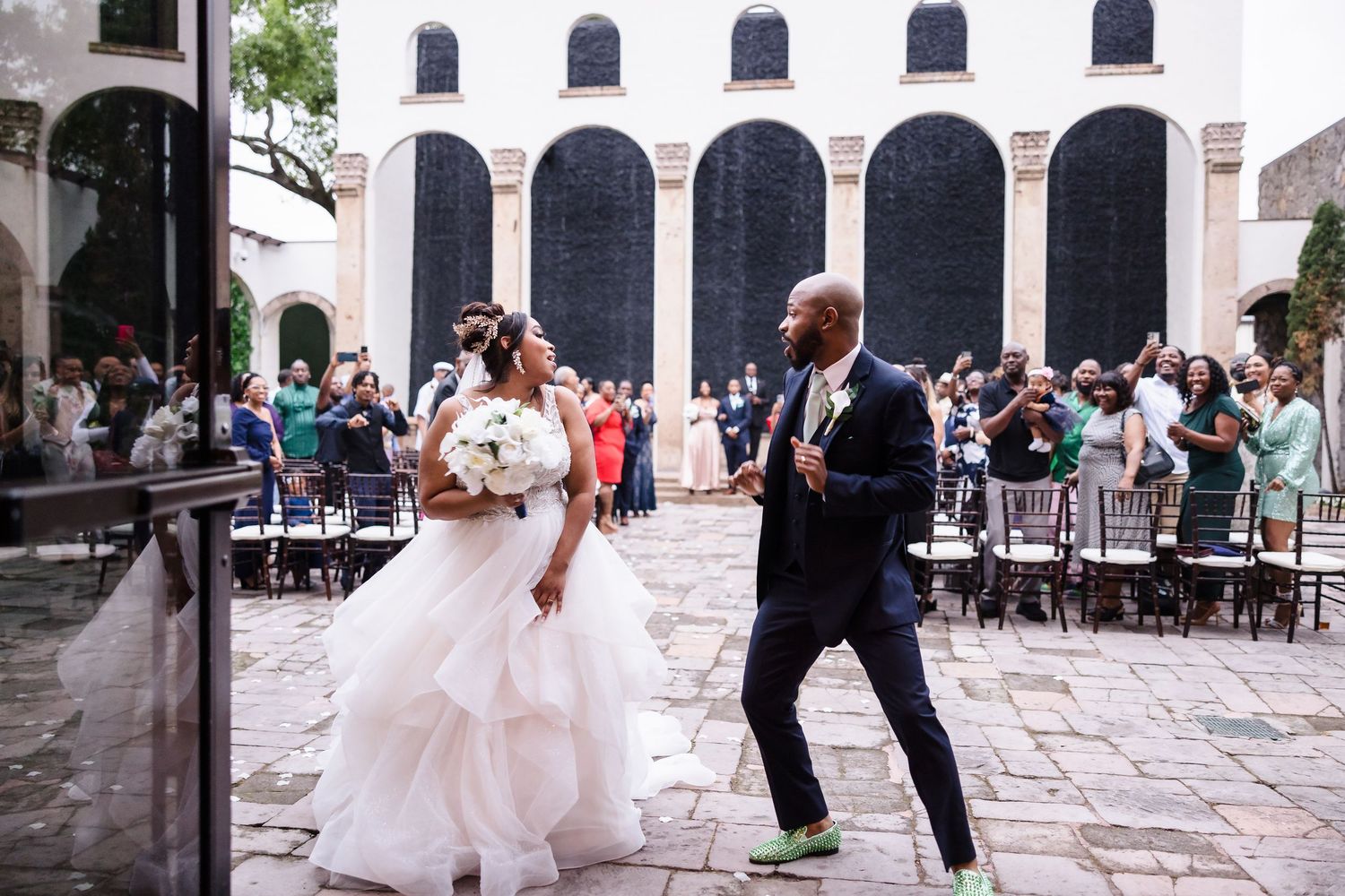 Outdoor wedding portrait with greenery background