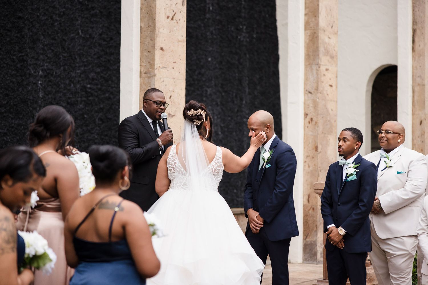 Bride wipes groom's tears during vows at The Bell Tower on 34th