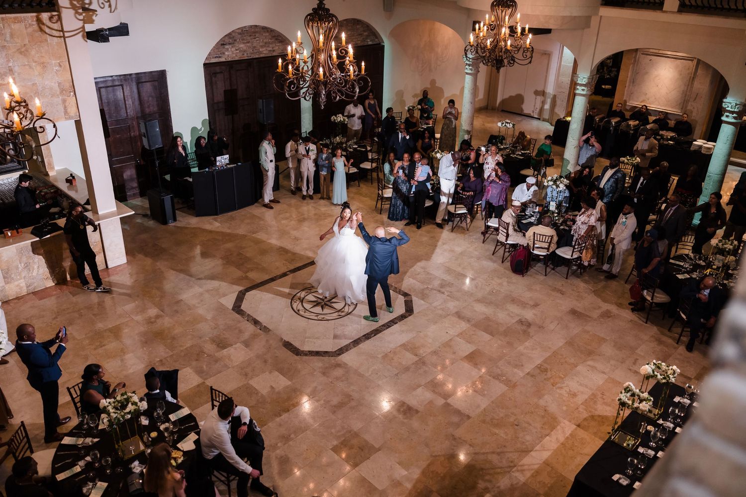 First dance under chandelier at Houston wedding