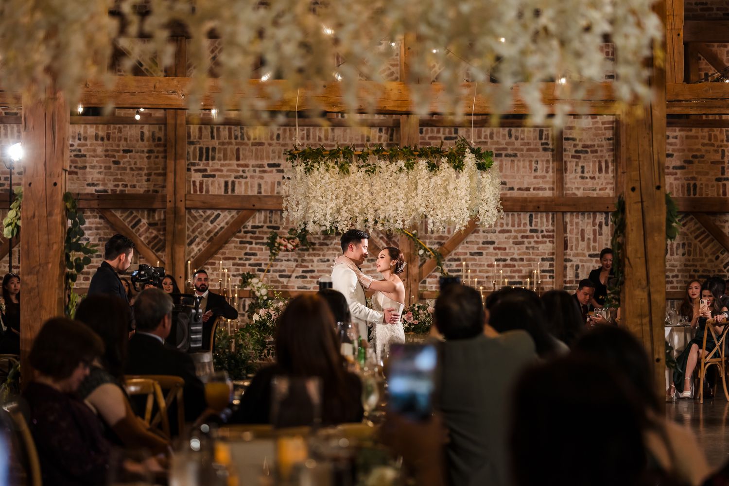 First dance under chandelier at Houston wedding